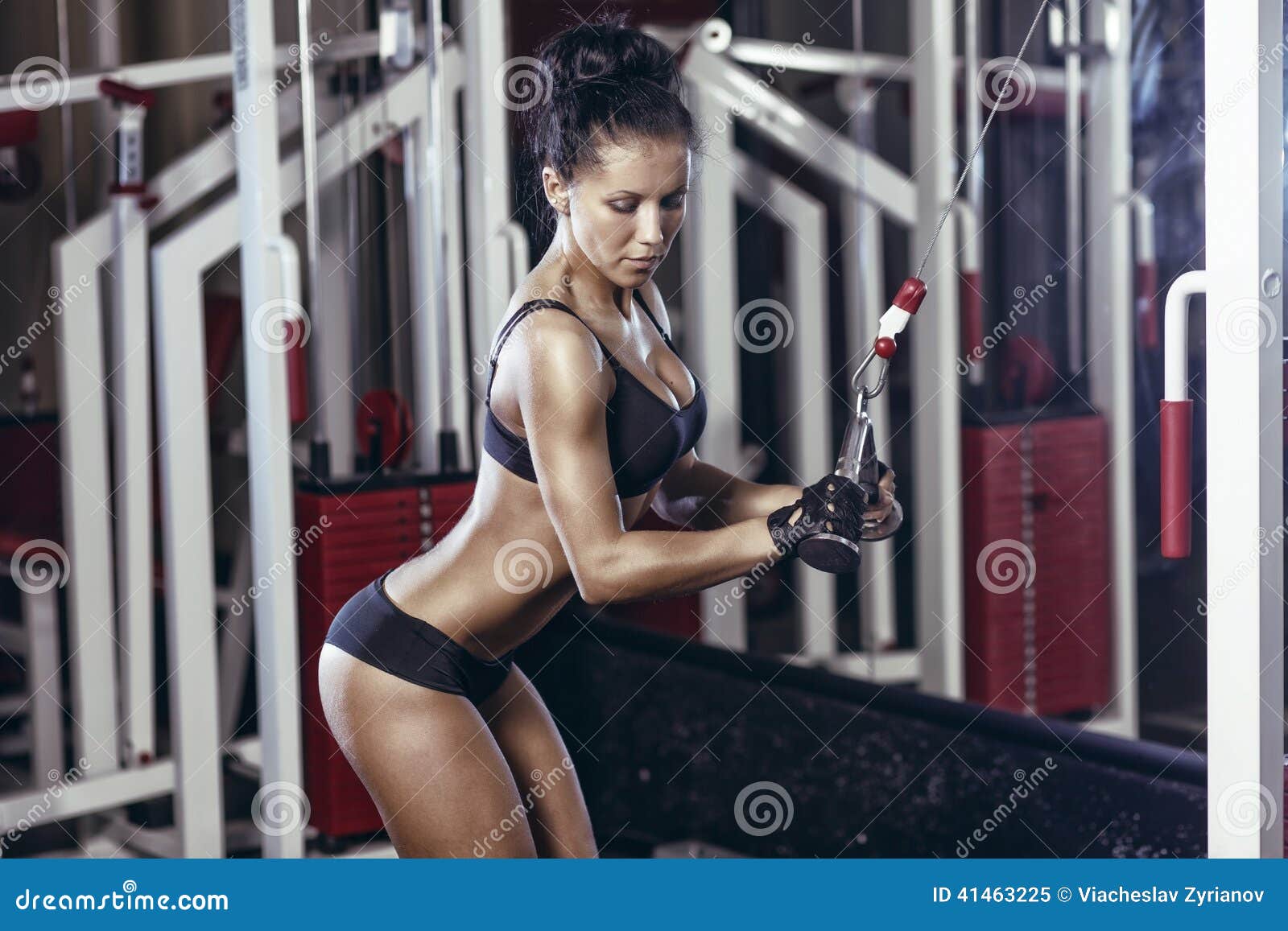 fitness woman doing triceps exercises in the gym