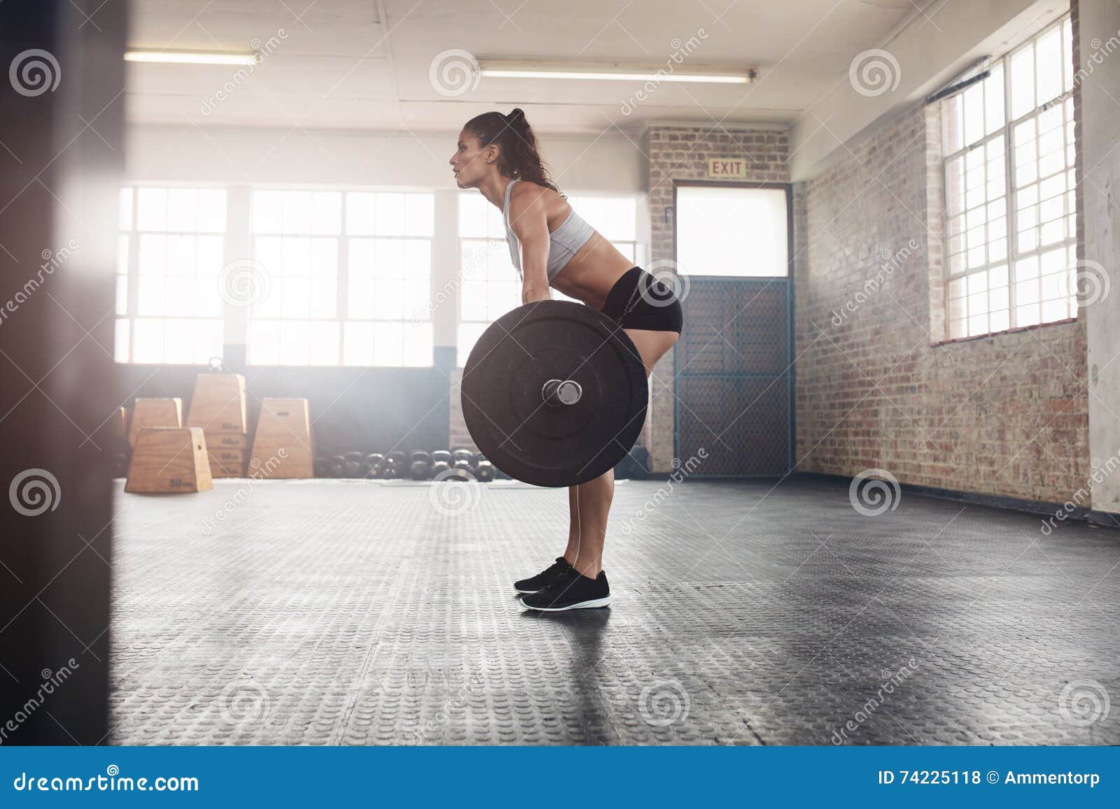 Fitness Woman Doing Weight Lifting at Health Club. Stock Photo - Image ...