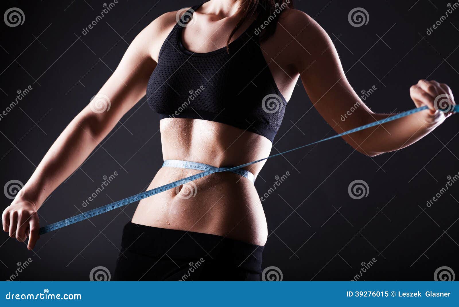 fitness woman measuring her waist, weight loss