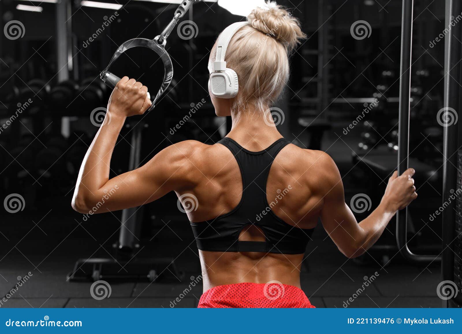 fitness woman muscular back gym athletic girl working out 221139476