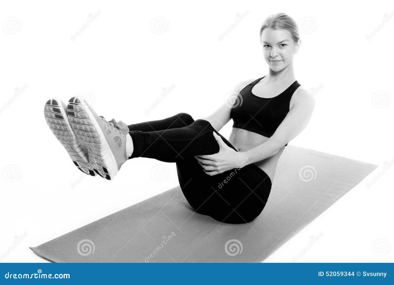 fitness woman in sport style standing against white background. Isolated. Big  boobs. Stock Photo