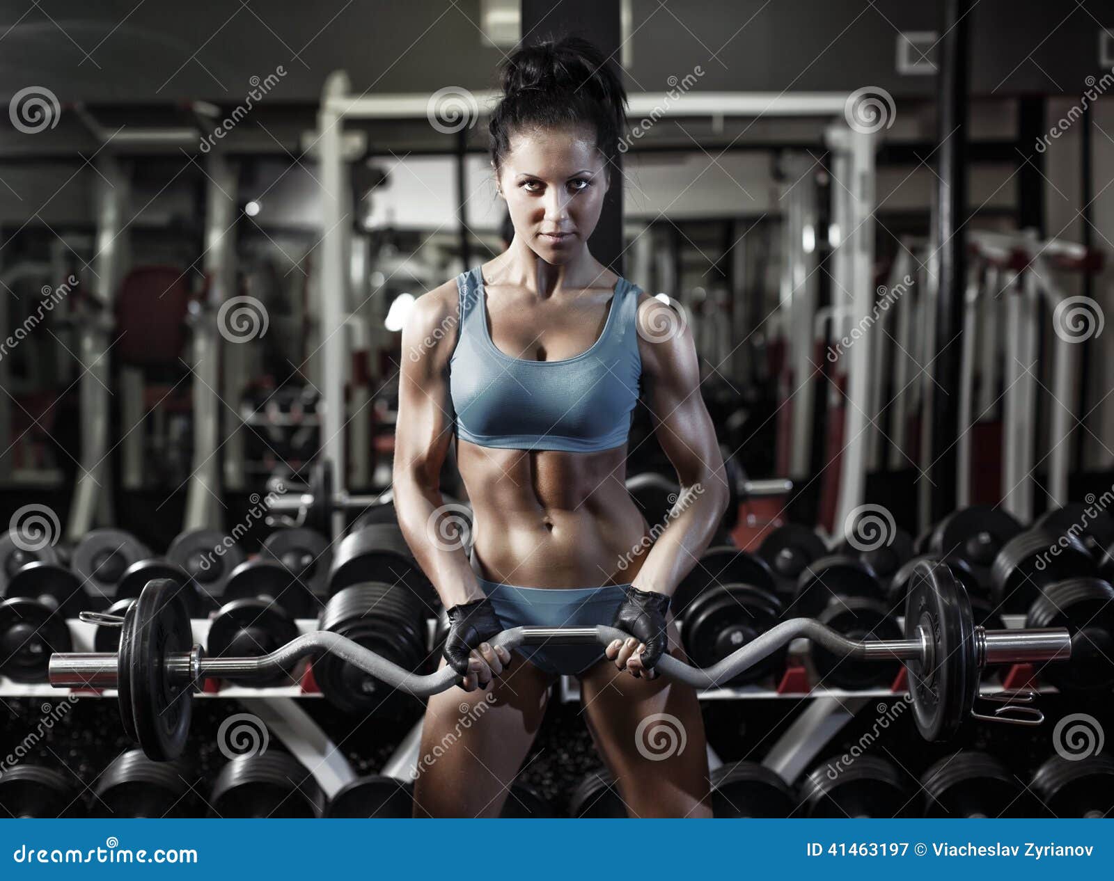 fitness woman push ups biceps with dumbbell