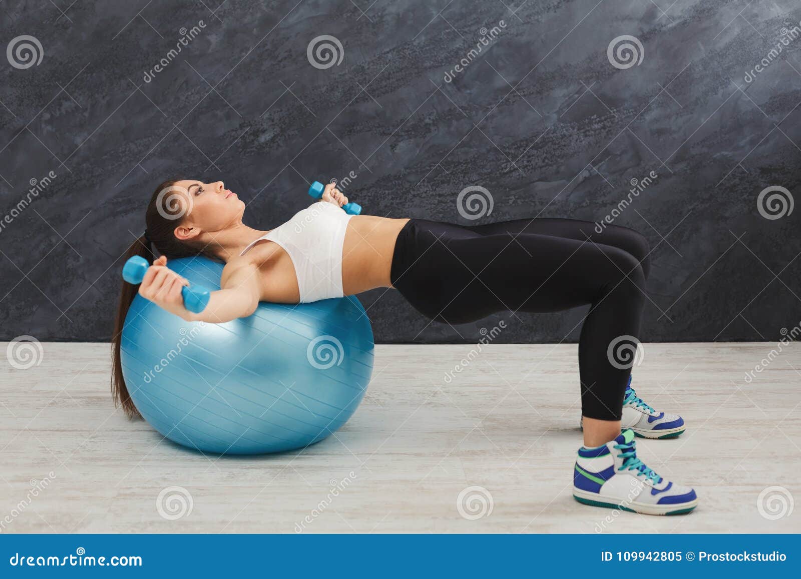 Fitness Woman Training With Fitness Ball And Dumbbells Indoors Stock Image Image Of Girl