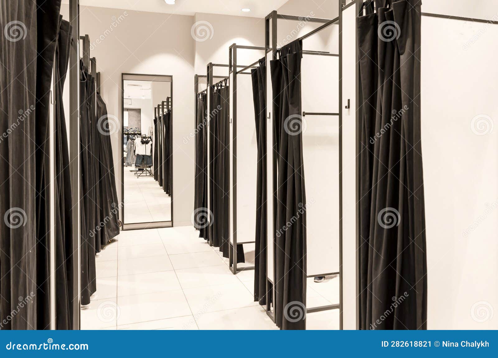 Fitting Booths in a Clothing Store. Dressing Room at the Store Stock
