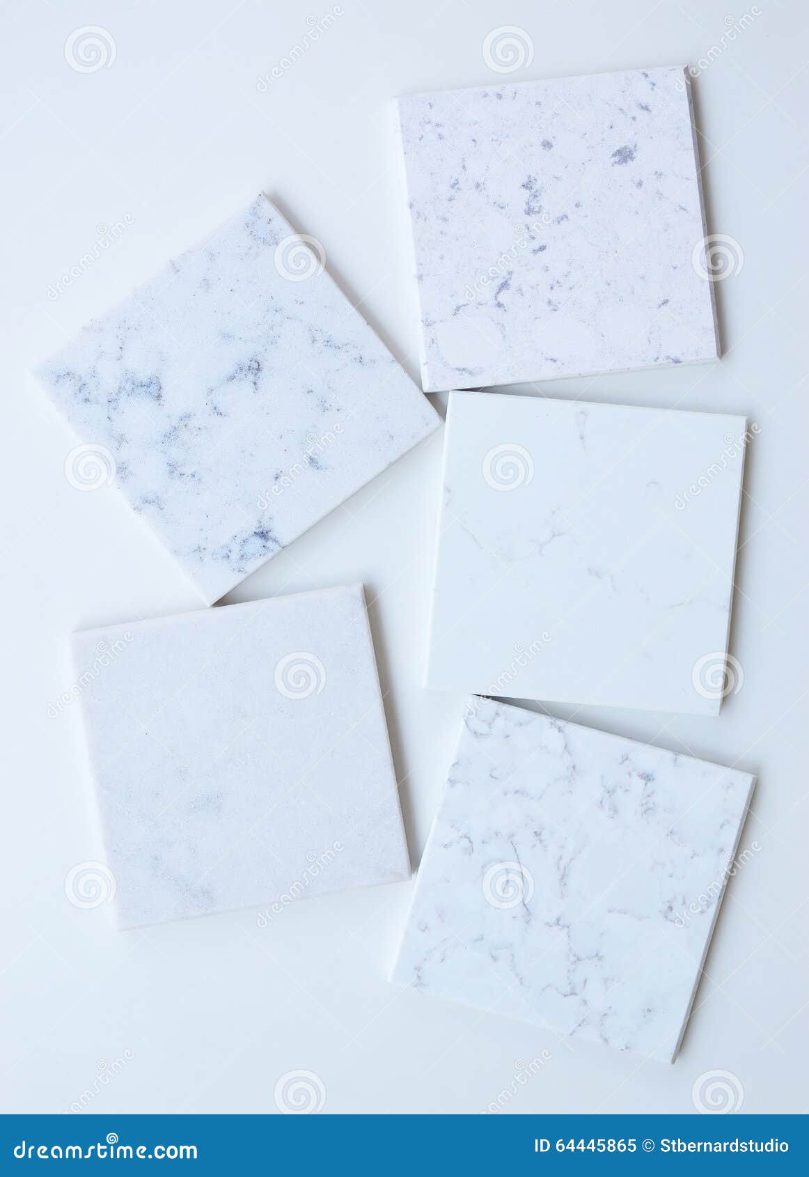 five different stone samples mainly white based with marble like grains and veins