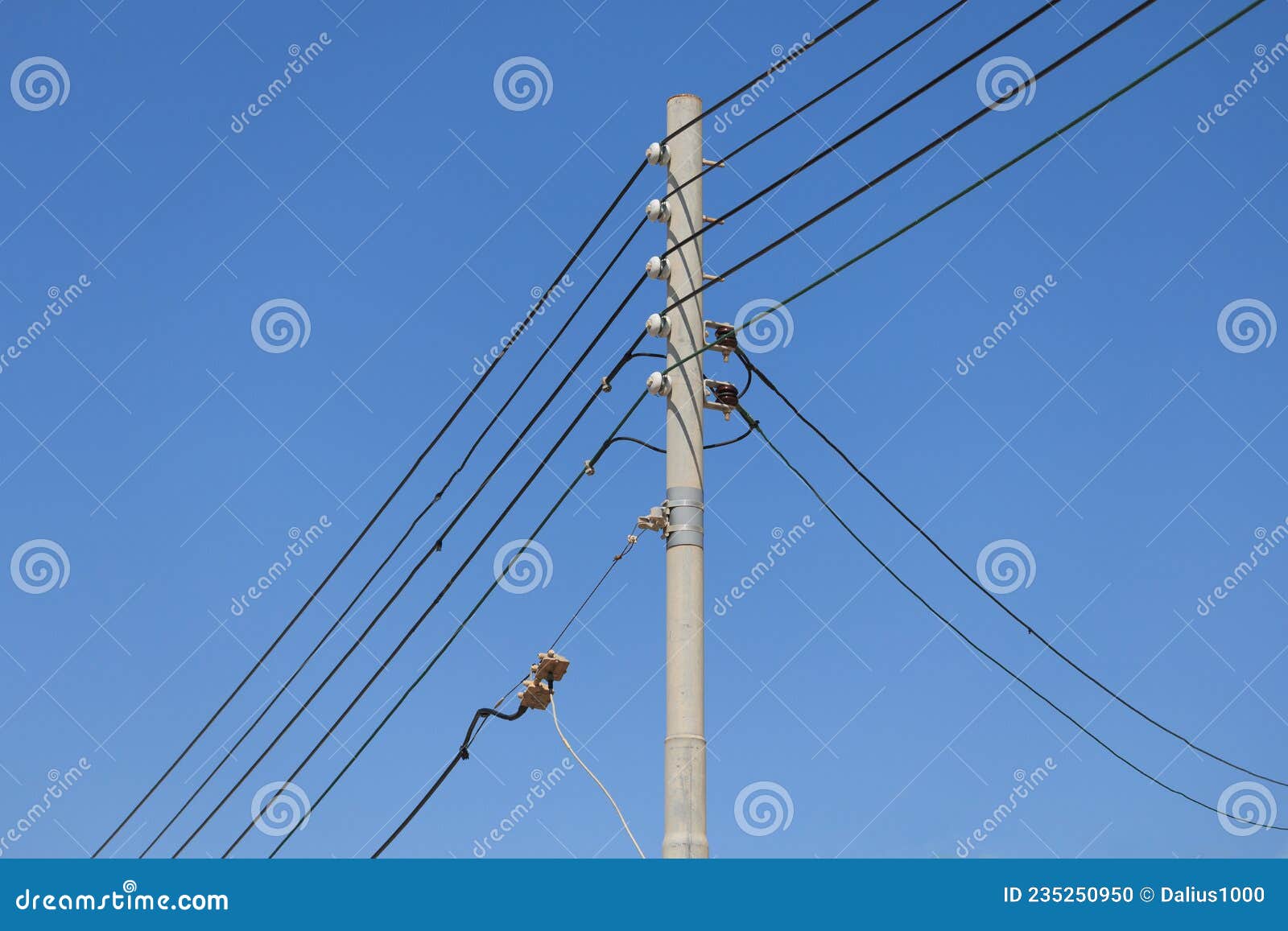 Five Electrical Cables on Pole in Malta Blue Sky Background Three