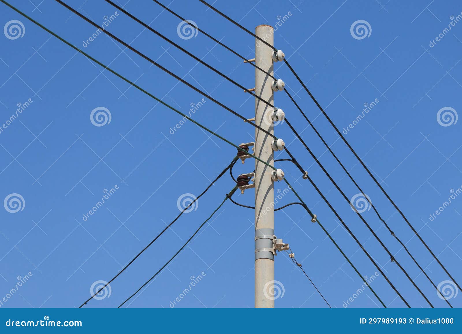 Five Electrical Cables on Pole in Malta Blue Sky Background Three