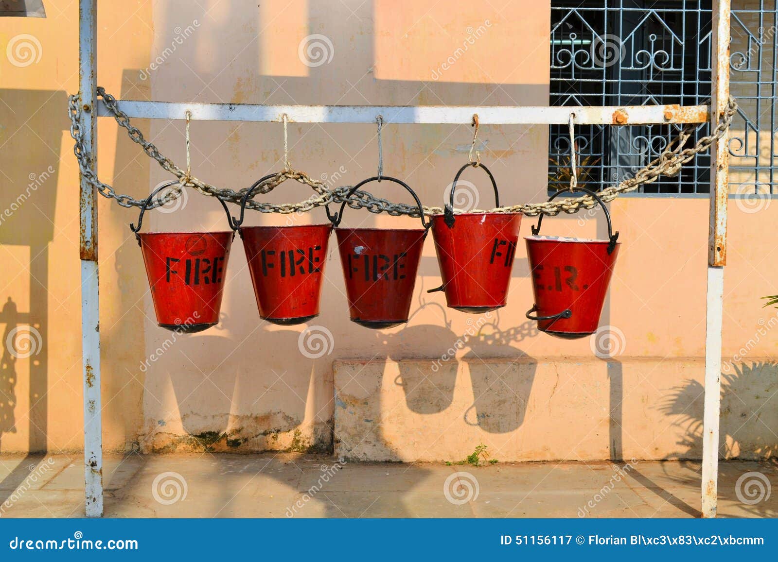 Five Fire Buckets Hanging on a Wall in India Stock Image Image of