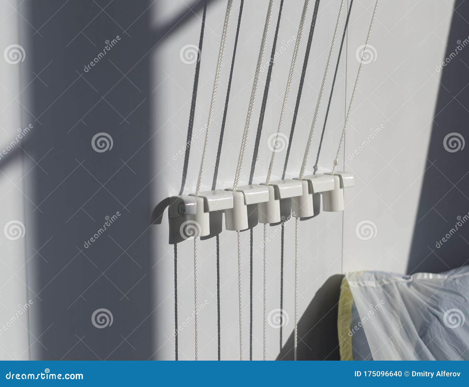 Five Holders with a Rope for Drying Clothes on the Balcony Stock Photo