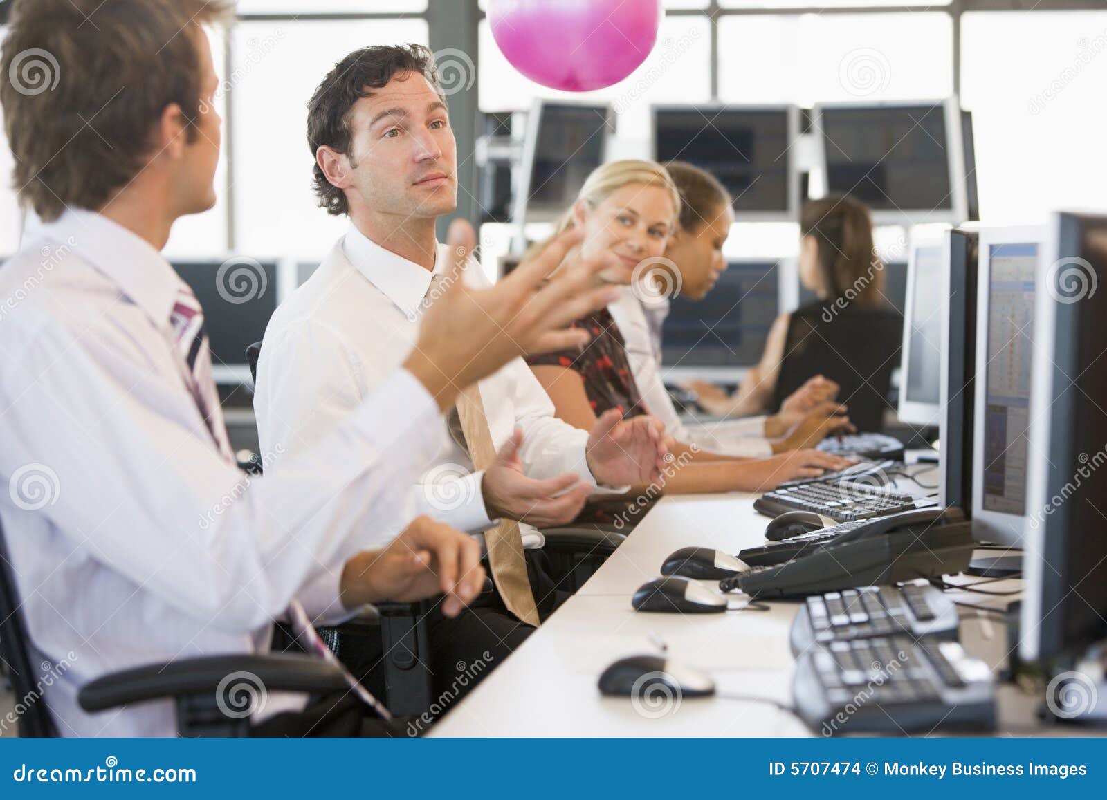 Five People in an Office Throwing a Ball Around Stock Photo Image of