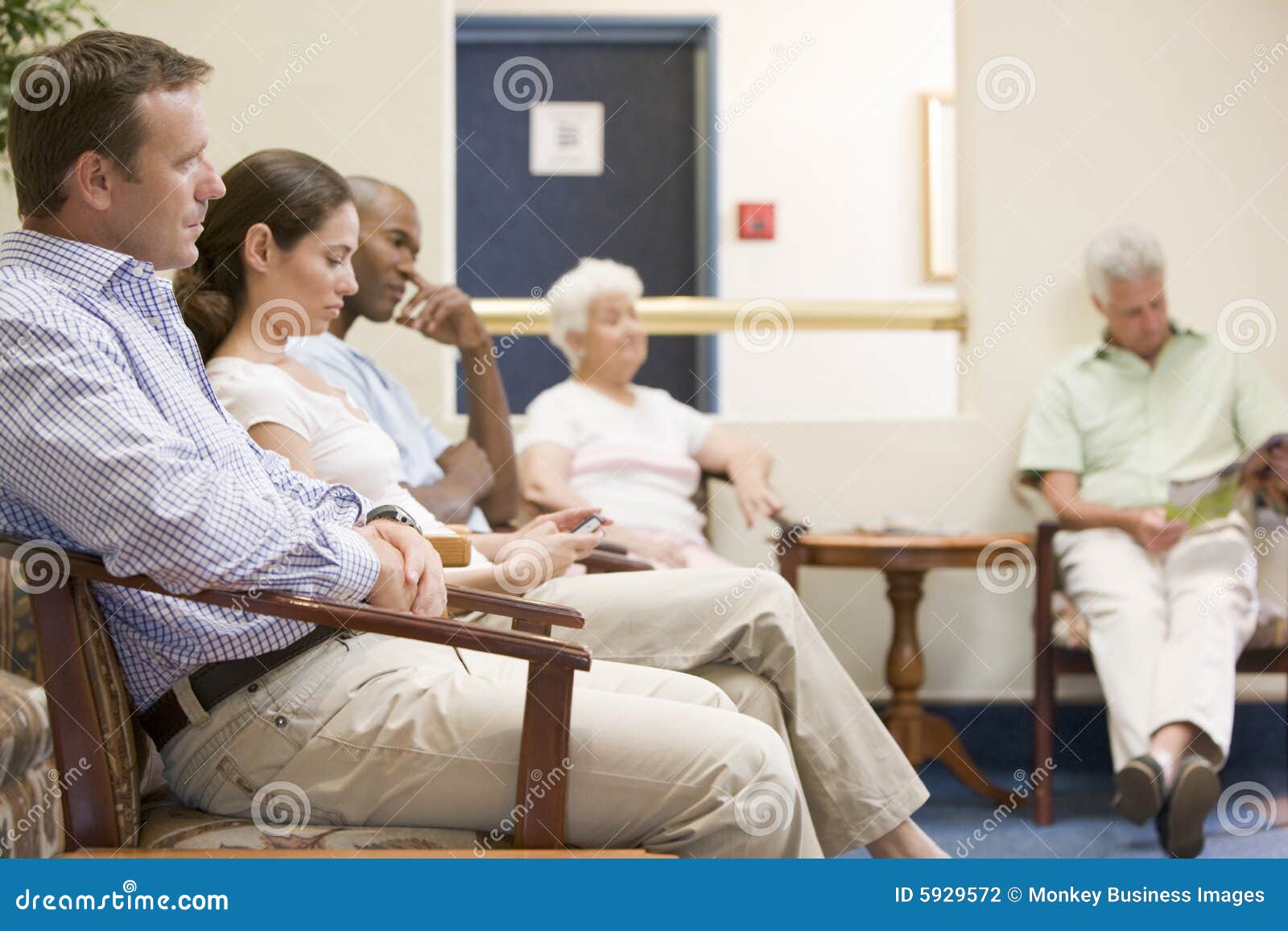 five people waiting in waiting room