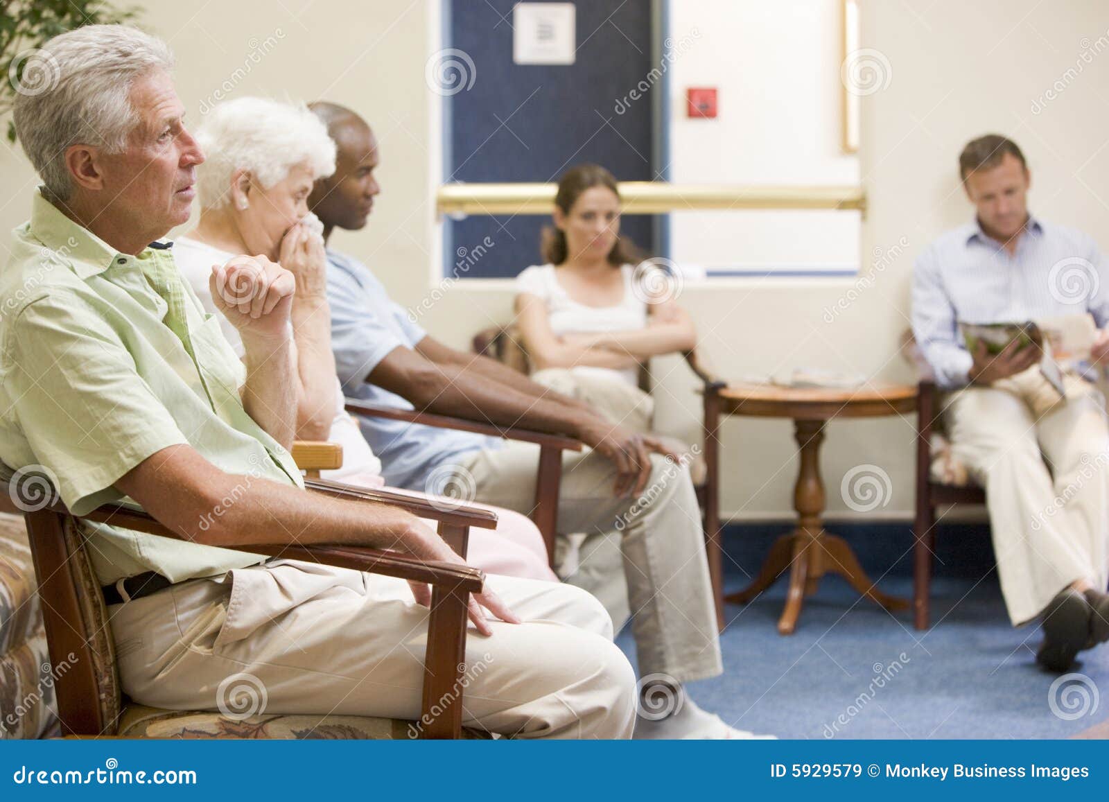 five people waiting in waiting room