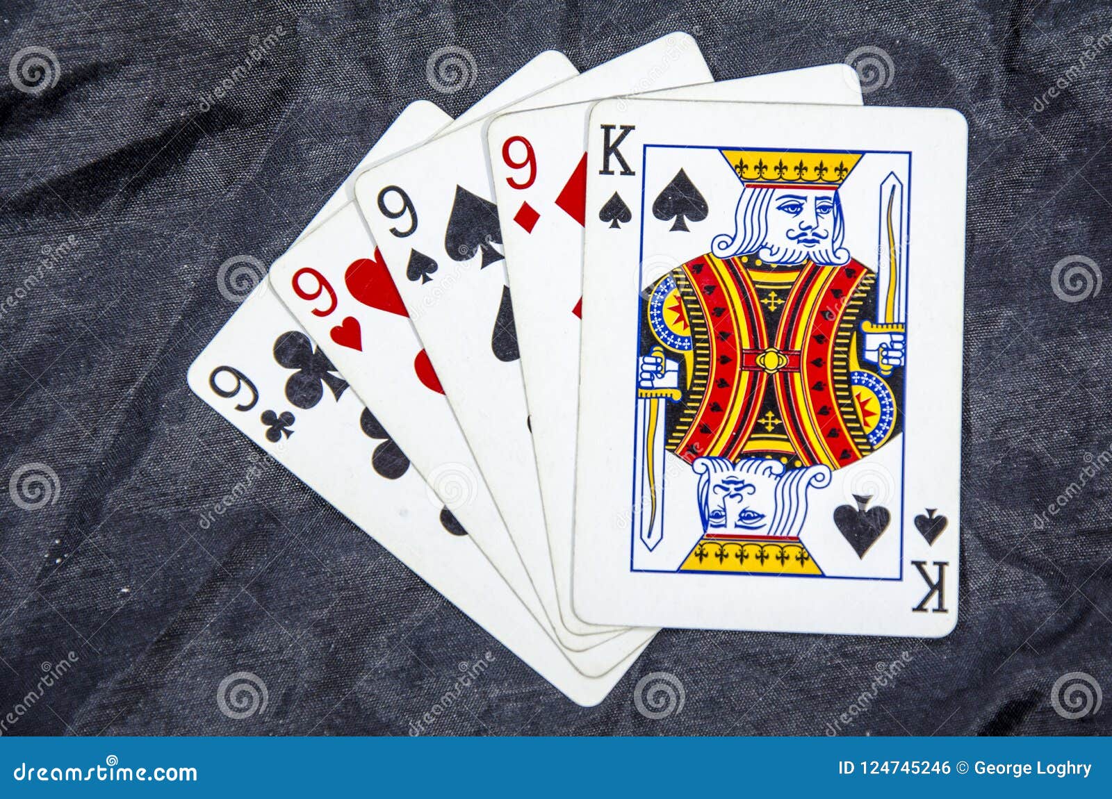 five playing cards four of a kind nine`s and a king