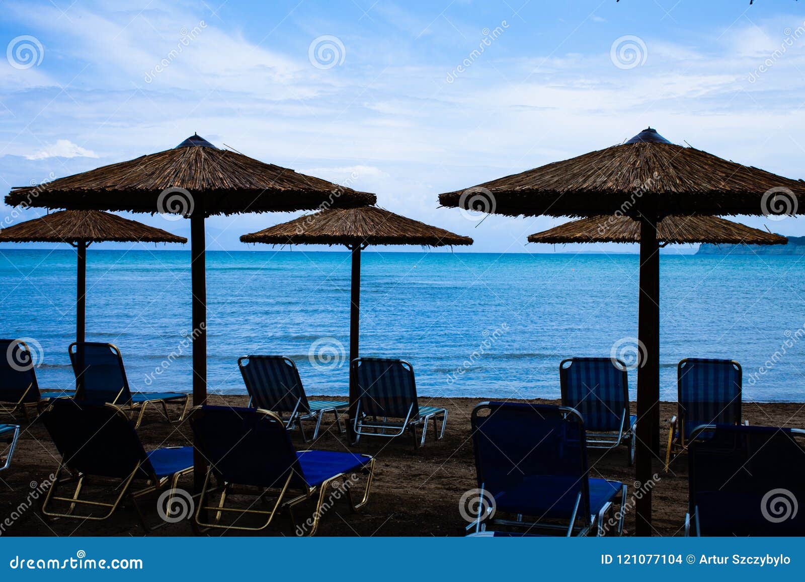 Five Rustic Palapa Umbrellas Located at the Shoreline of the ...