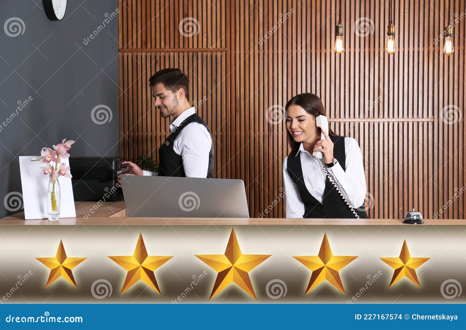 five star luxury hotel. receptionists working at desk