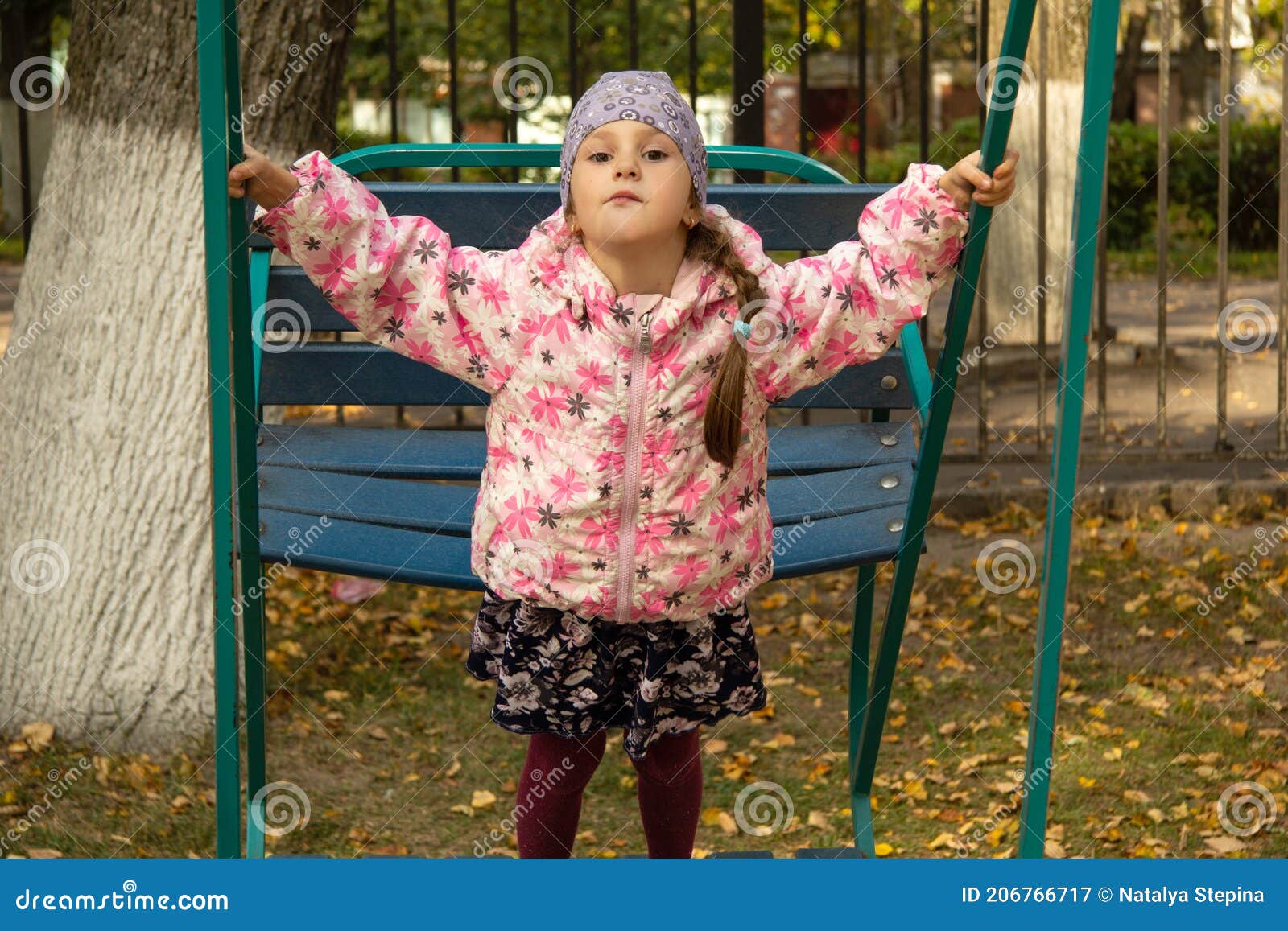 Five Year Old Girl Swings on Big Swings in Park in Fall Stock Image Image of cold, seesaw