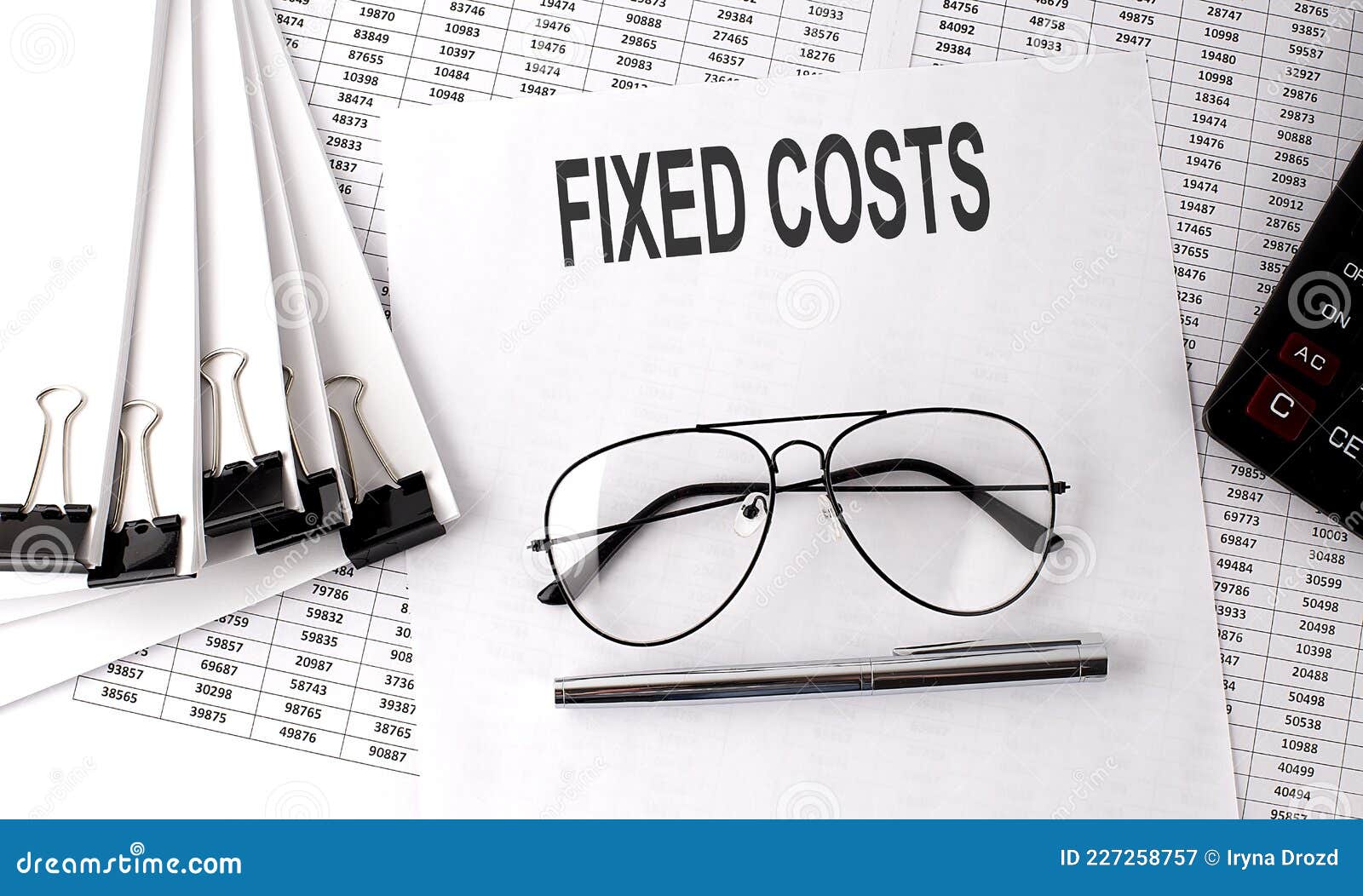 FIXED COSTS Text on the Paper with Chart and Office Tools , Business