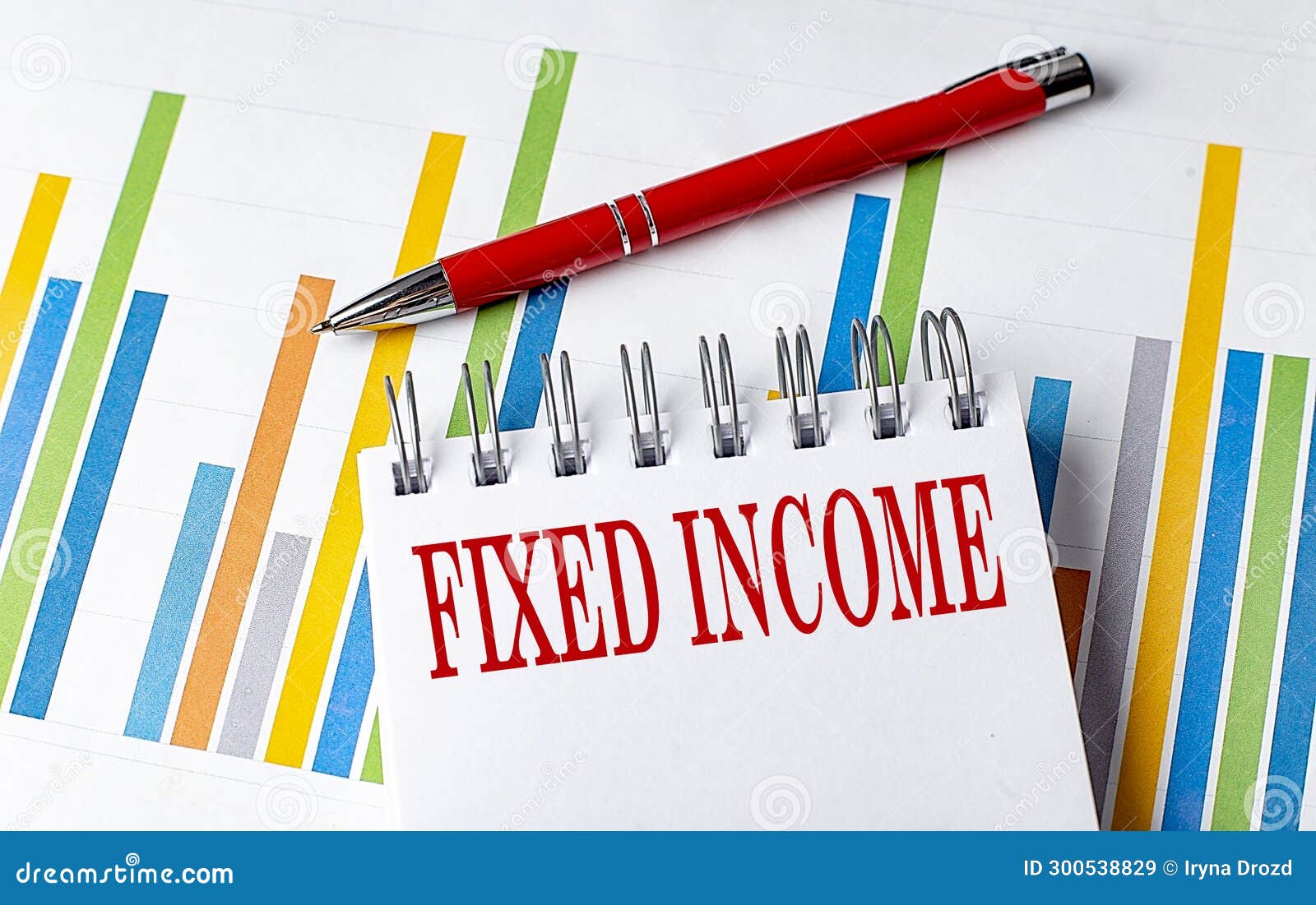 fixed income text on a notebook with chart and pen business concept