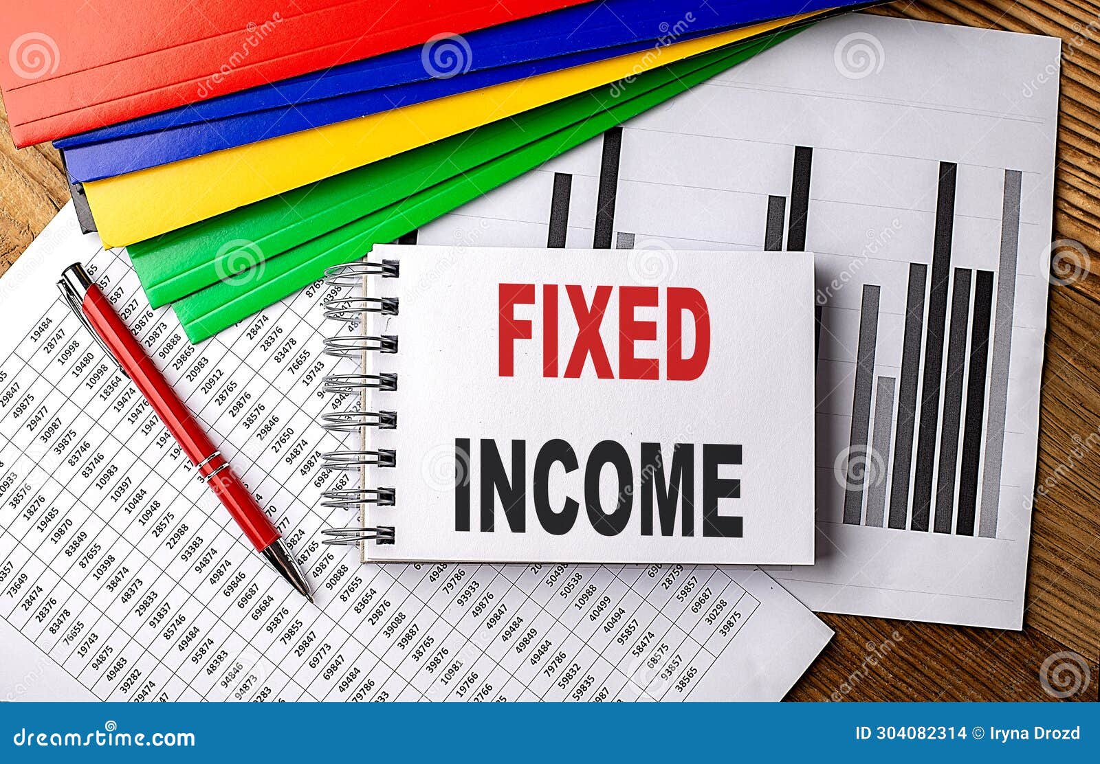 fixed income text on notebook with pen, folder on a chart background