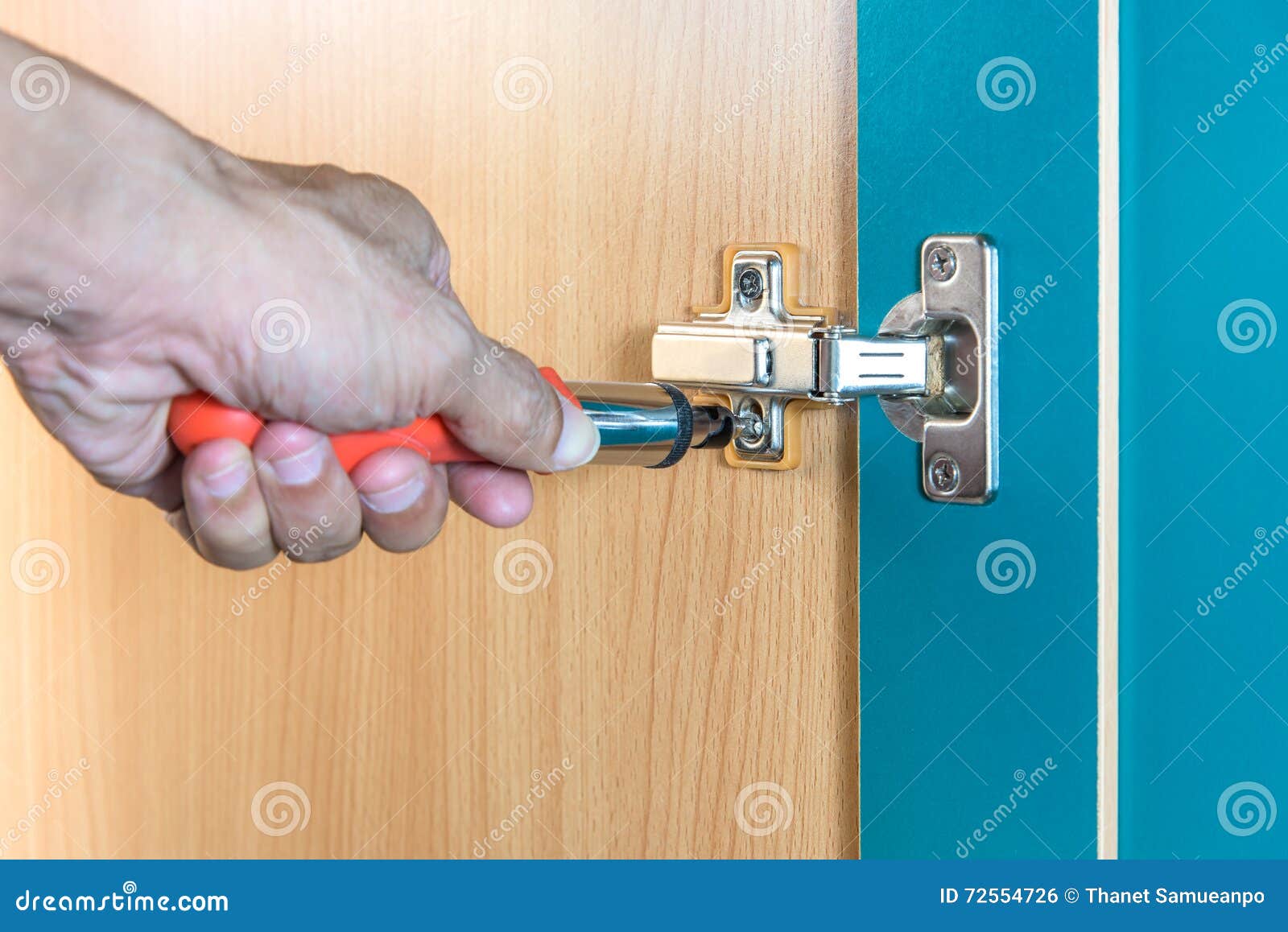 Fixing Cabinet Door Hinge Using A Screwdriver Stock Photo Image