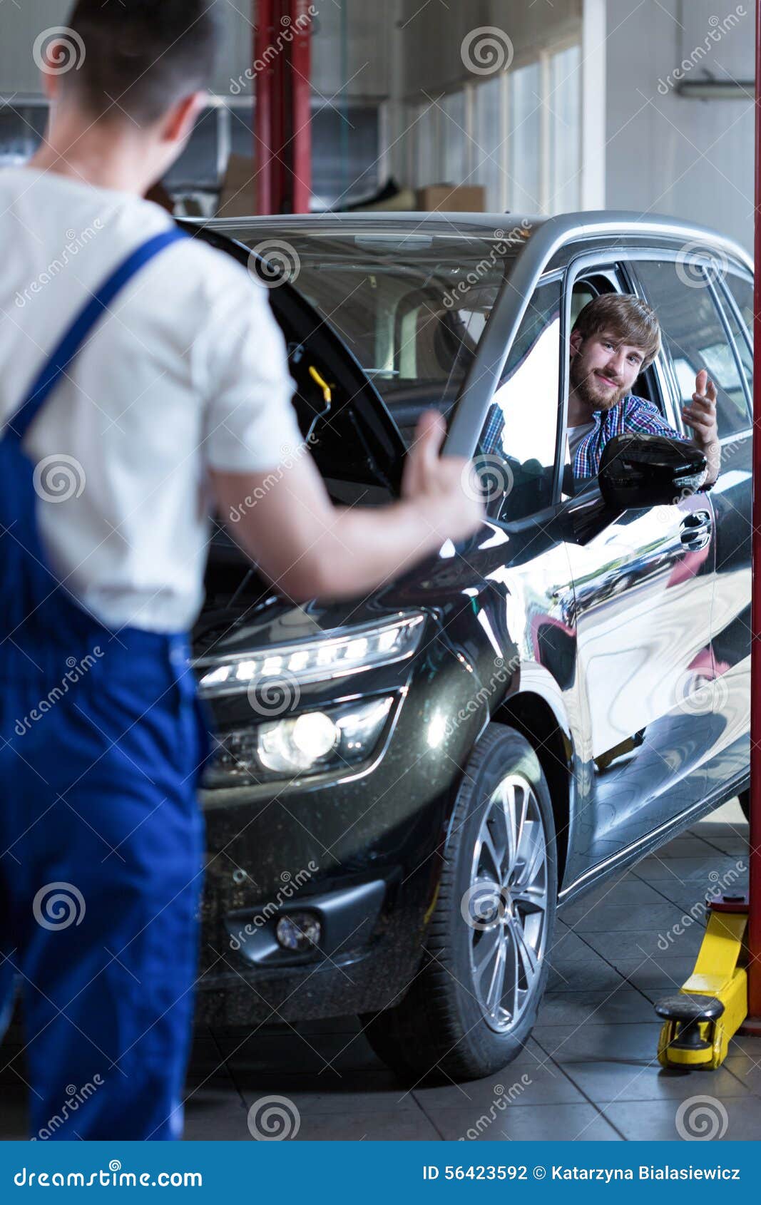 Fixing a car stock photo. Image of machinist, mechanic 56423592