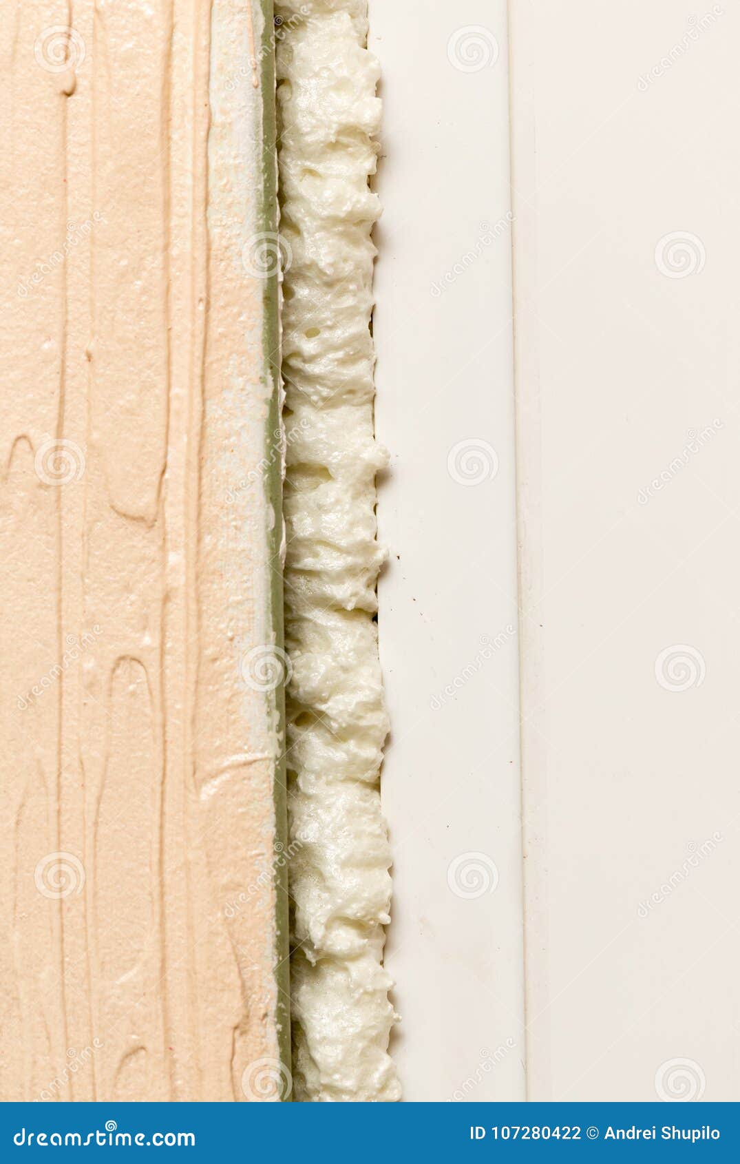 Construction Foam Between Pink Extruded Styrofoam Sheets Stock Photo