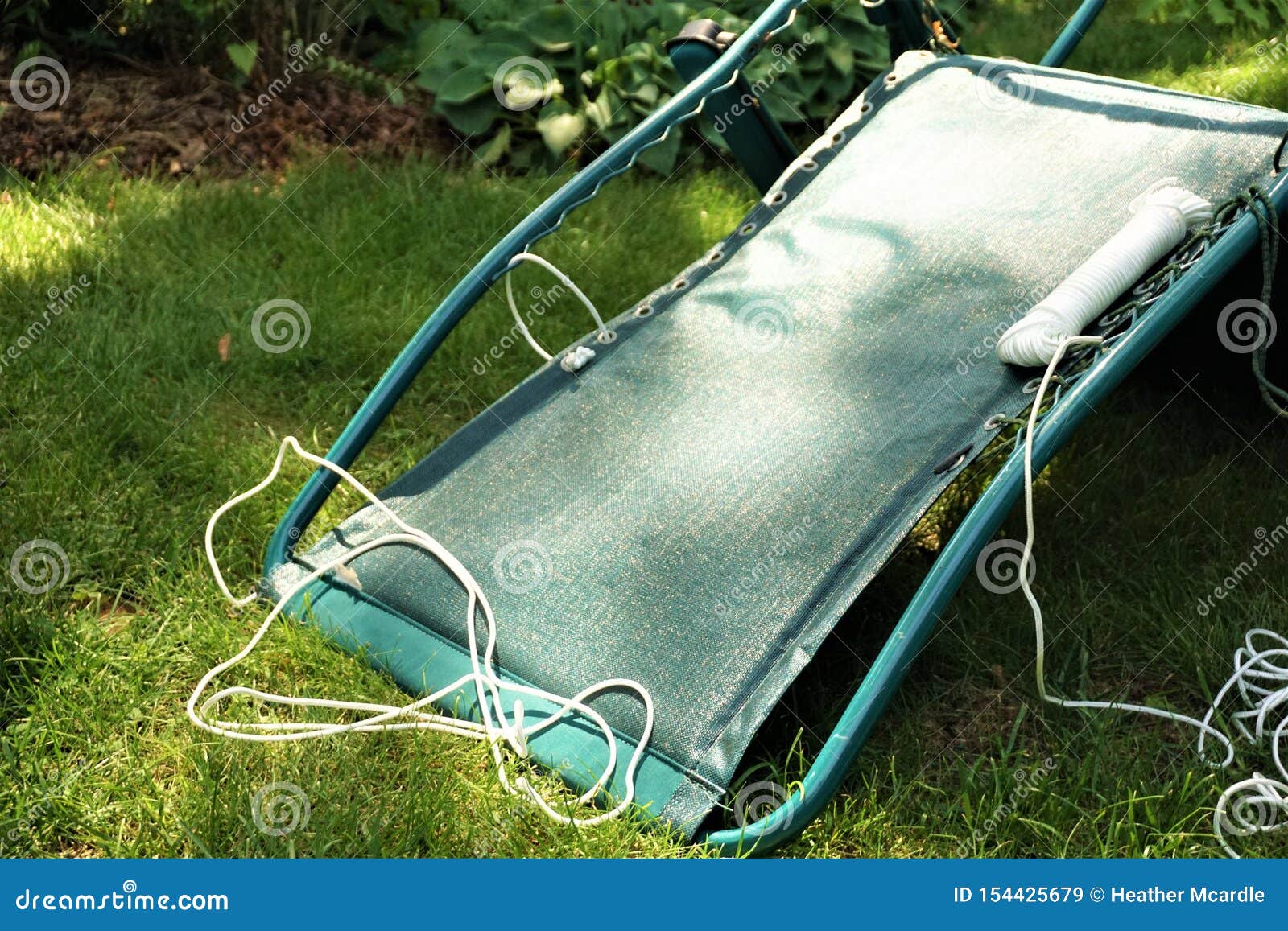 Fixing Lawn Chair Do it Yourself Project on Lawn Stock Image - Image of