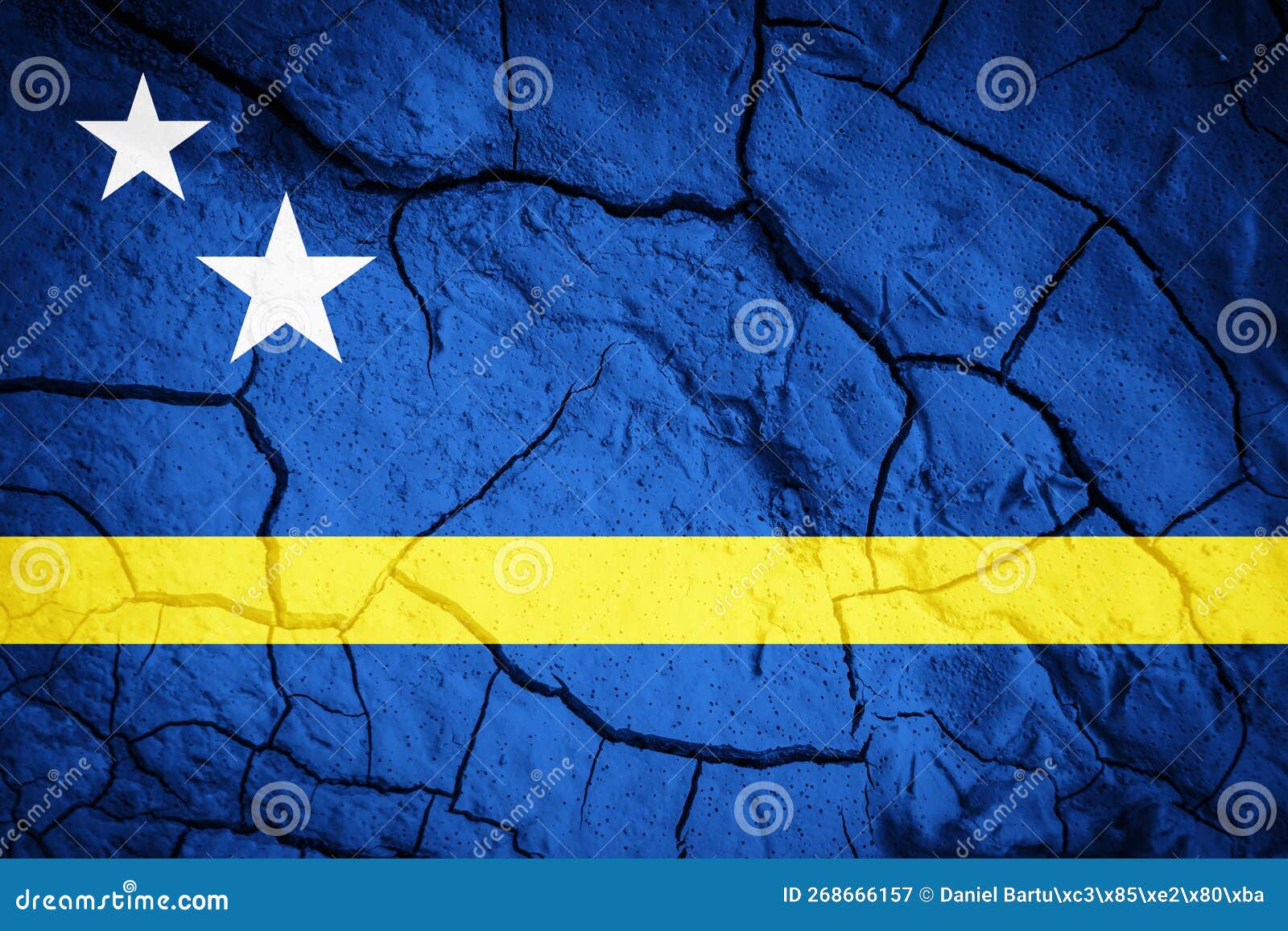 flag of curaÃ§ao. curacao . flag on the background of dry cracked earth.