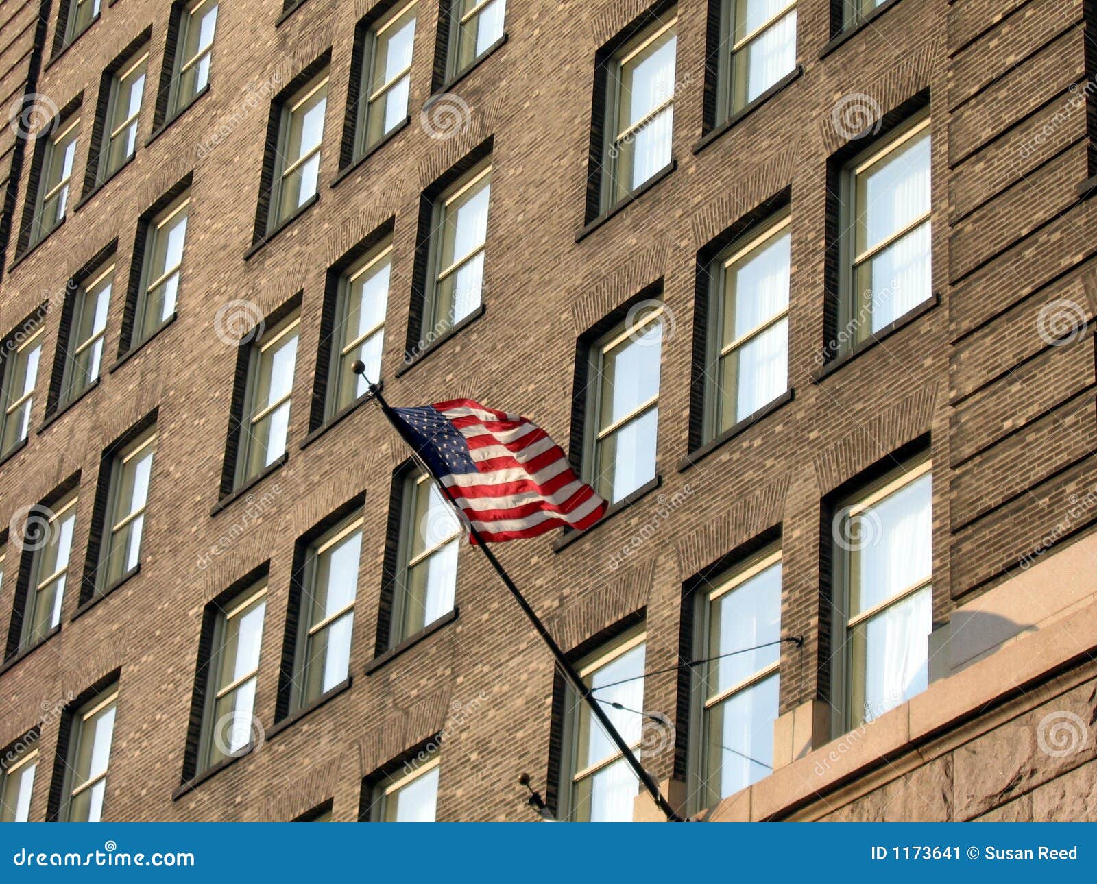 Flag on Old Brick Building stock image. Image of building - 1173641