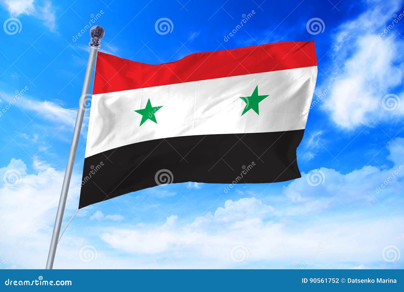 Flag of Syria Syrian Arab Republic Developing Against a Blue Sky Stock