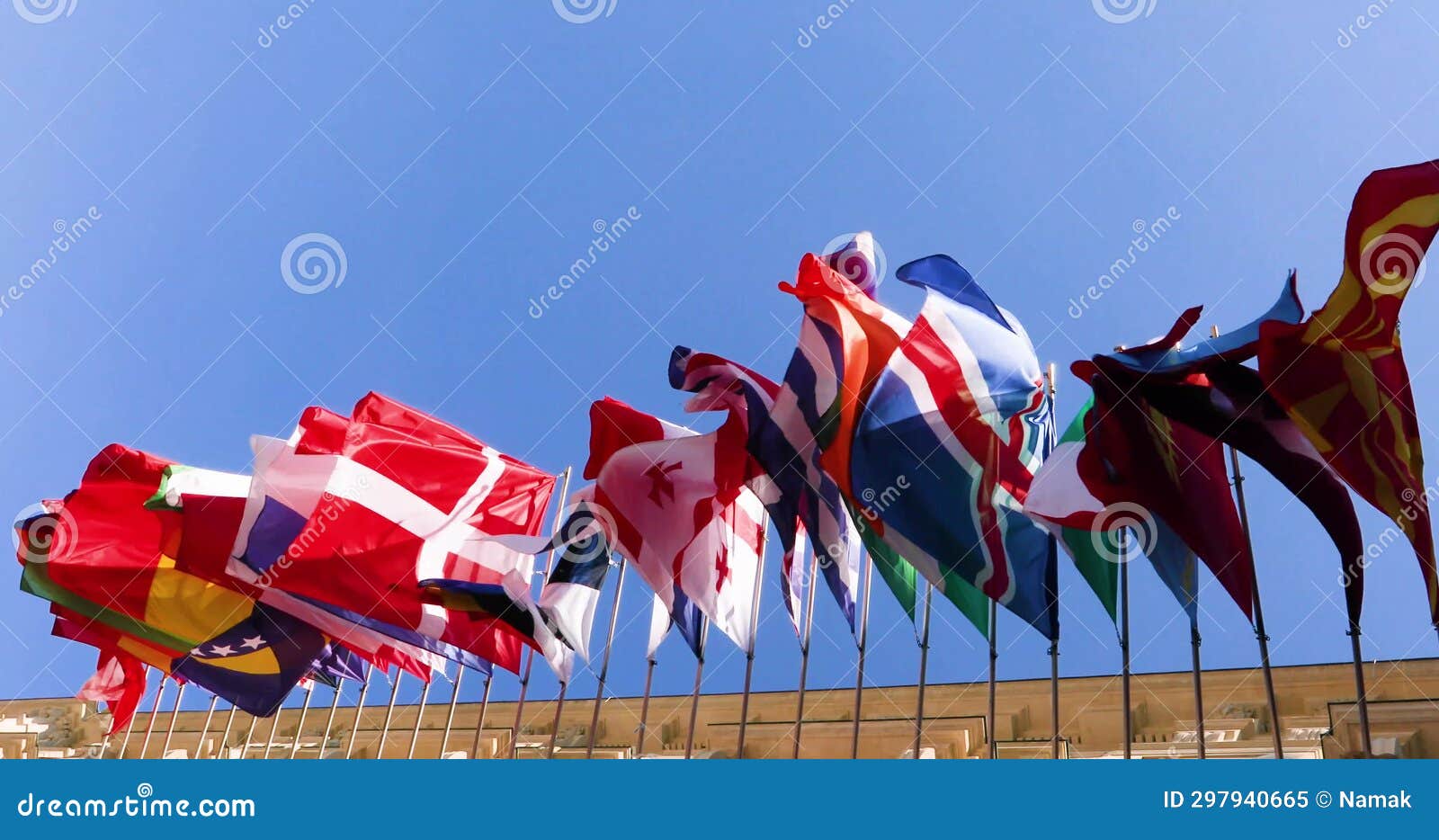Flags of All Countries Against the Background of the Blue Sky Flutter