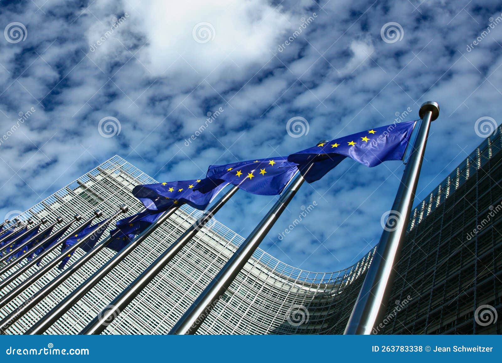 eu flags in the wind in front of the berlaymont building in brussels