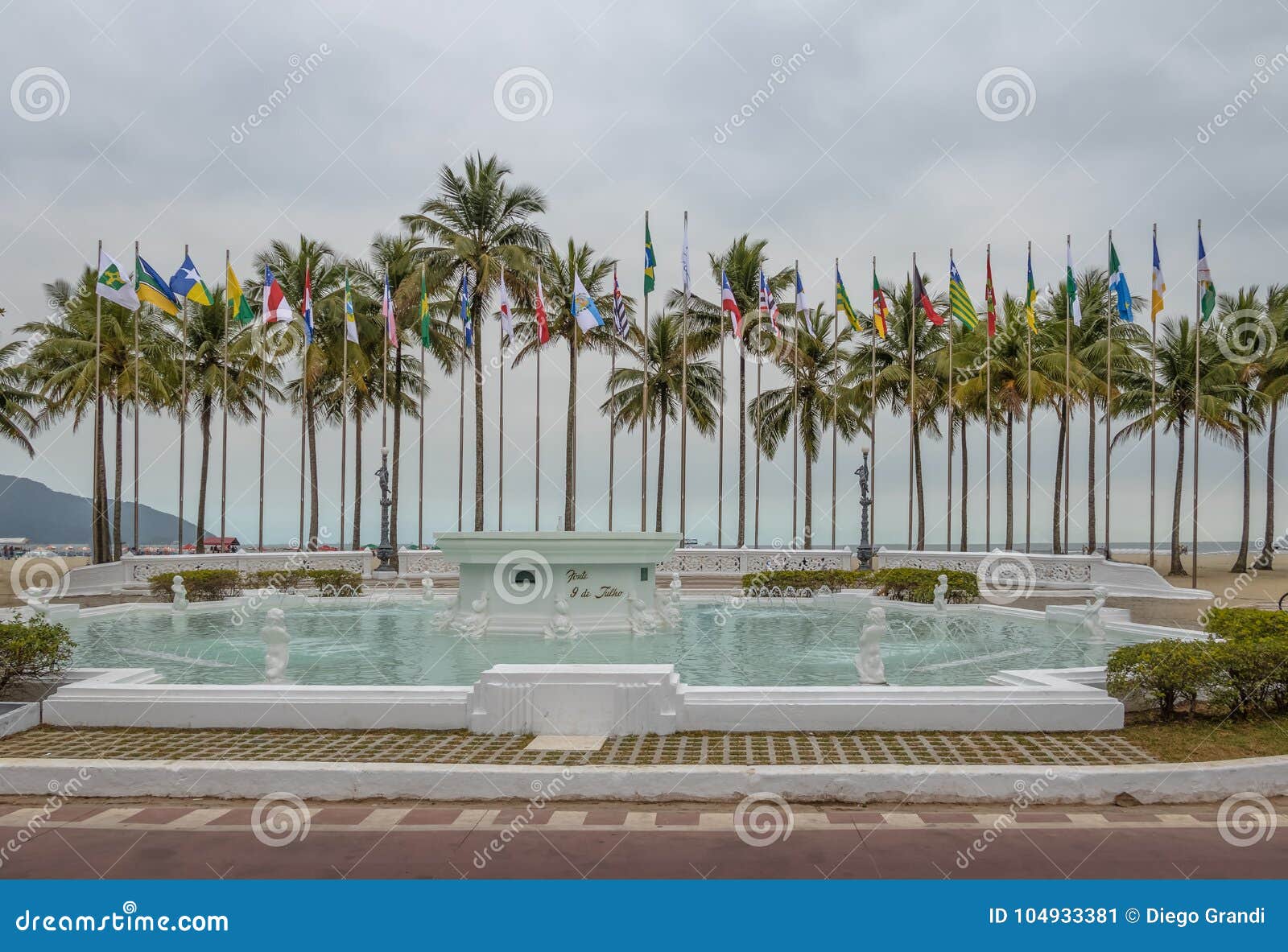 flags square praca das bandeiras and 9 de julho fountain at coastal garden of santos beach - santos, sao paulo, brazil