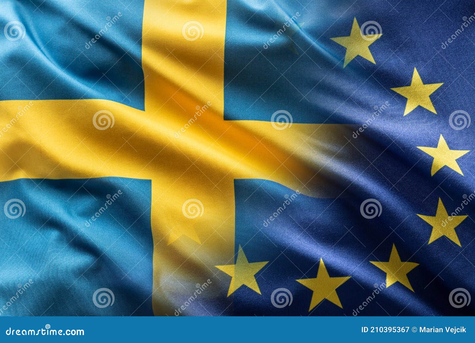 flags of sweden and eu blowing in the wind