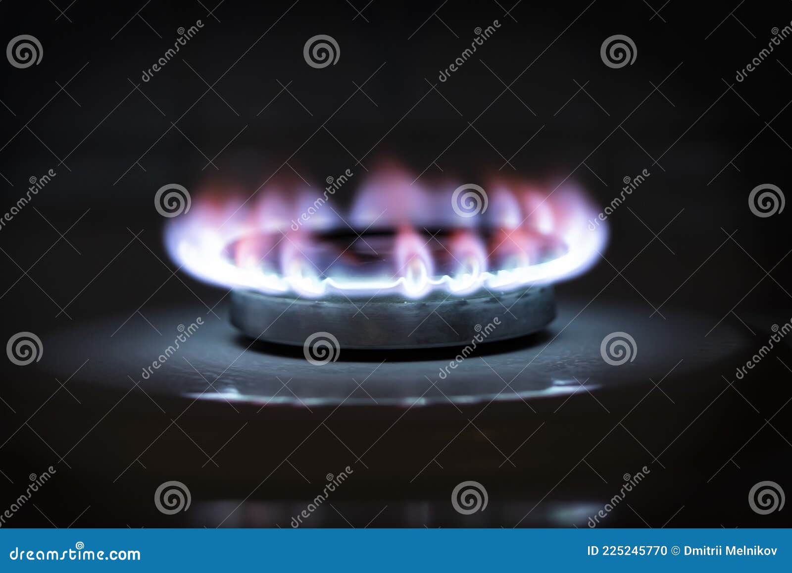 The Flame of a Burning Gas Fire on a Black Background. Burning Blue Gas