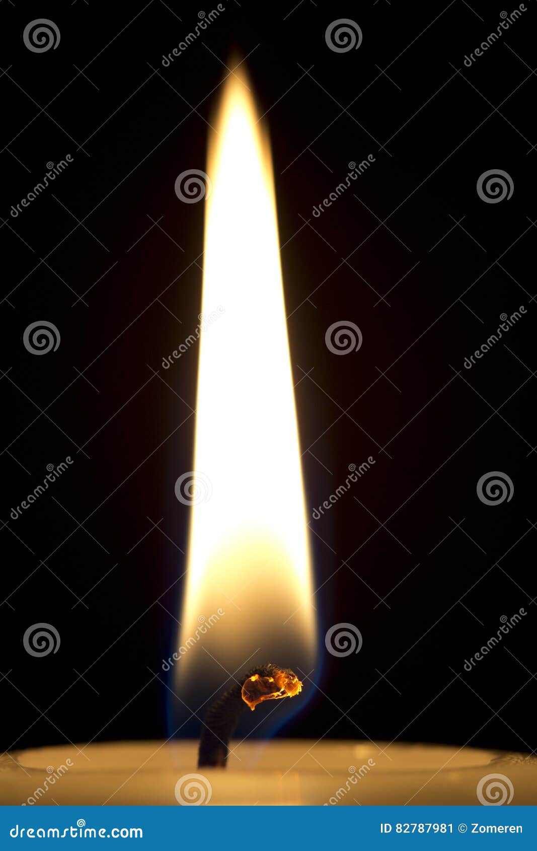 A Flame with a Closeup of a Burning Candle Wick on a Black Background