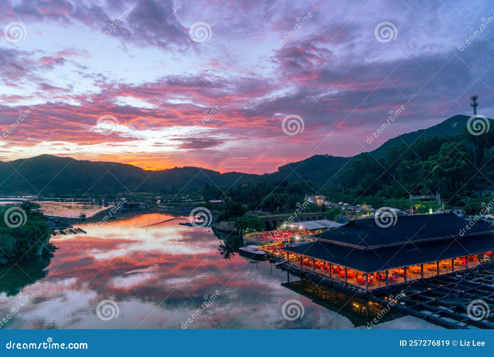 amazing flaming red fire clouds over fishing port