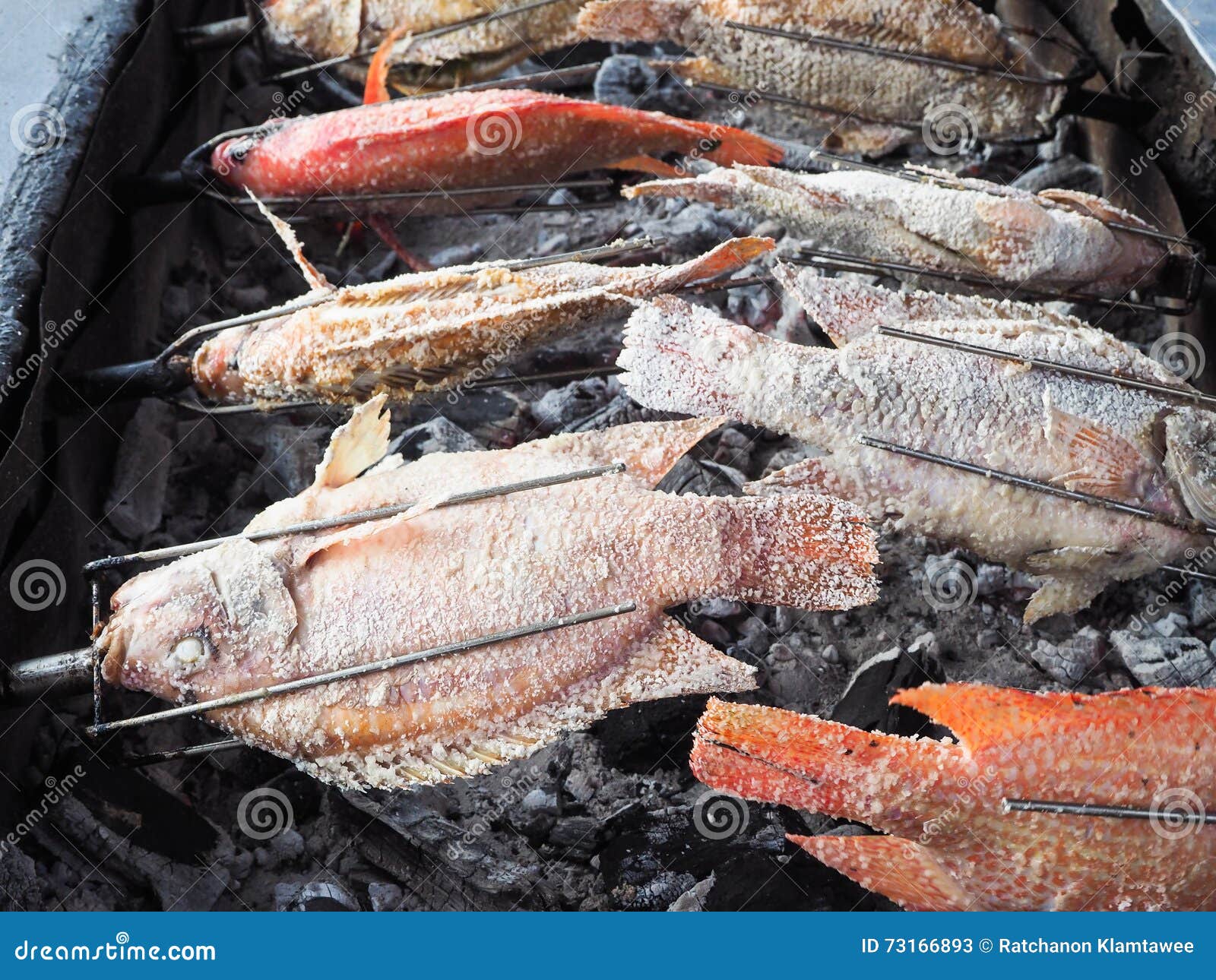 Flaming tilapia the grill. stock image. Image of grilled 73166893