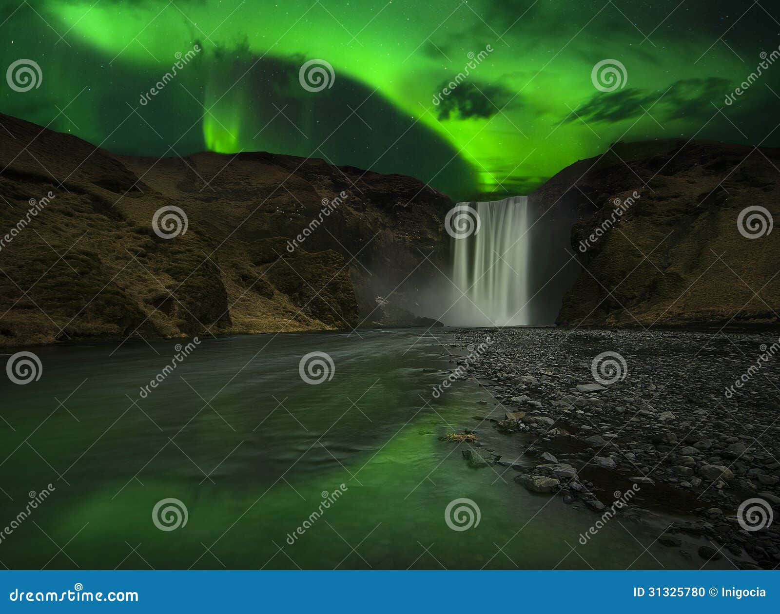 flash of aurora polaris above waterfall