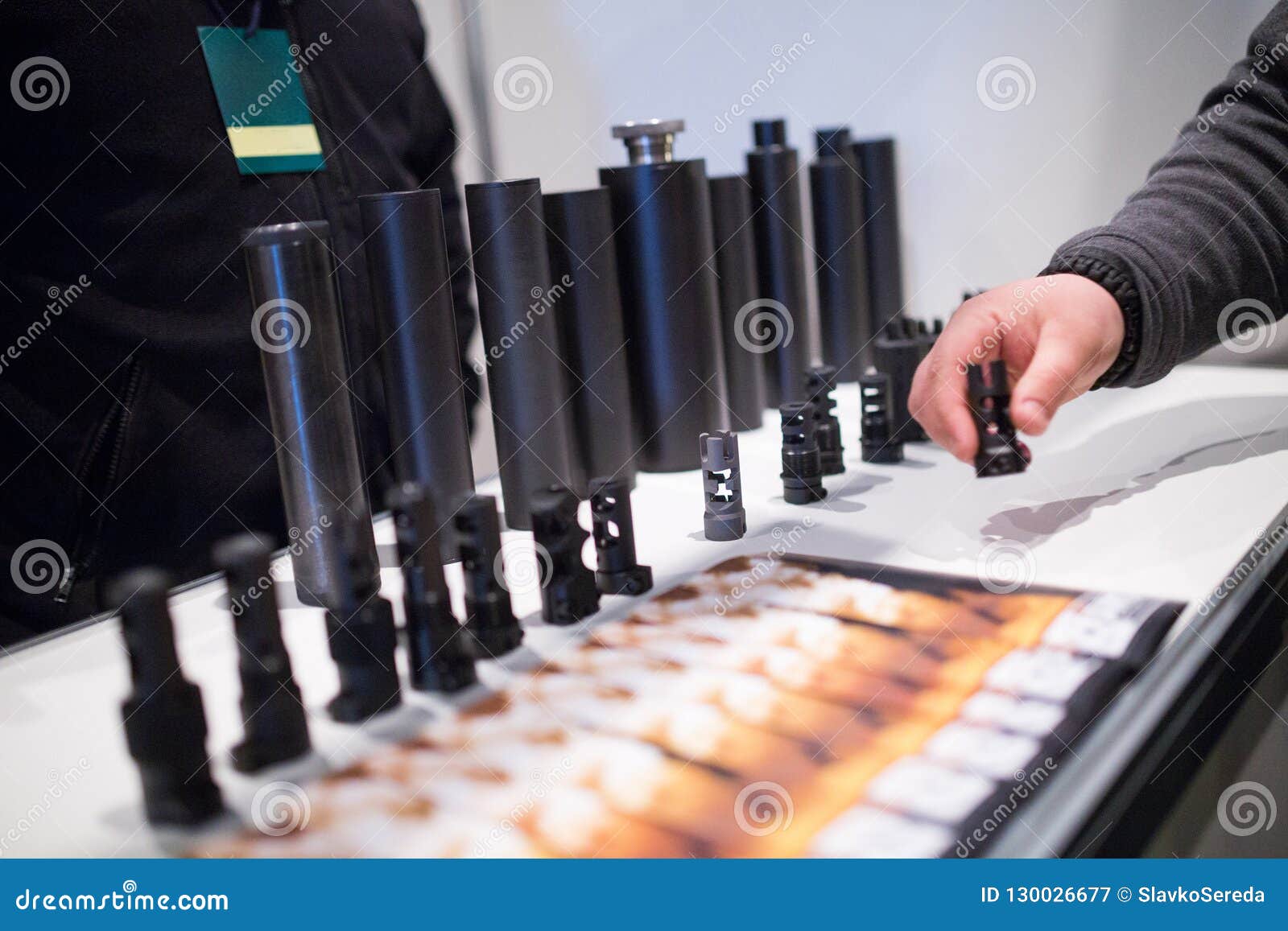 flash suppressors or muzzle brakes of a modern assault rifles. s