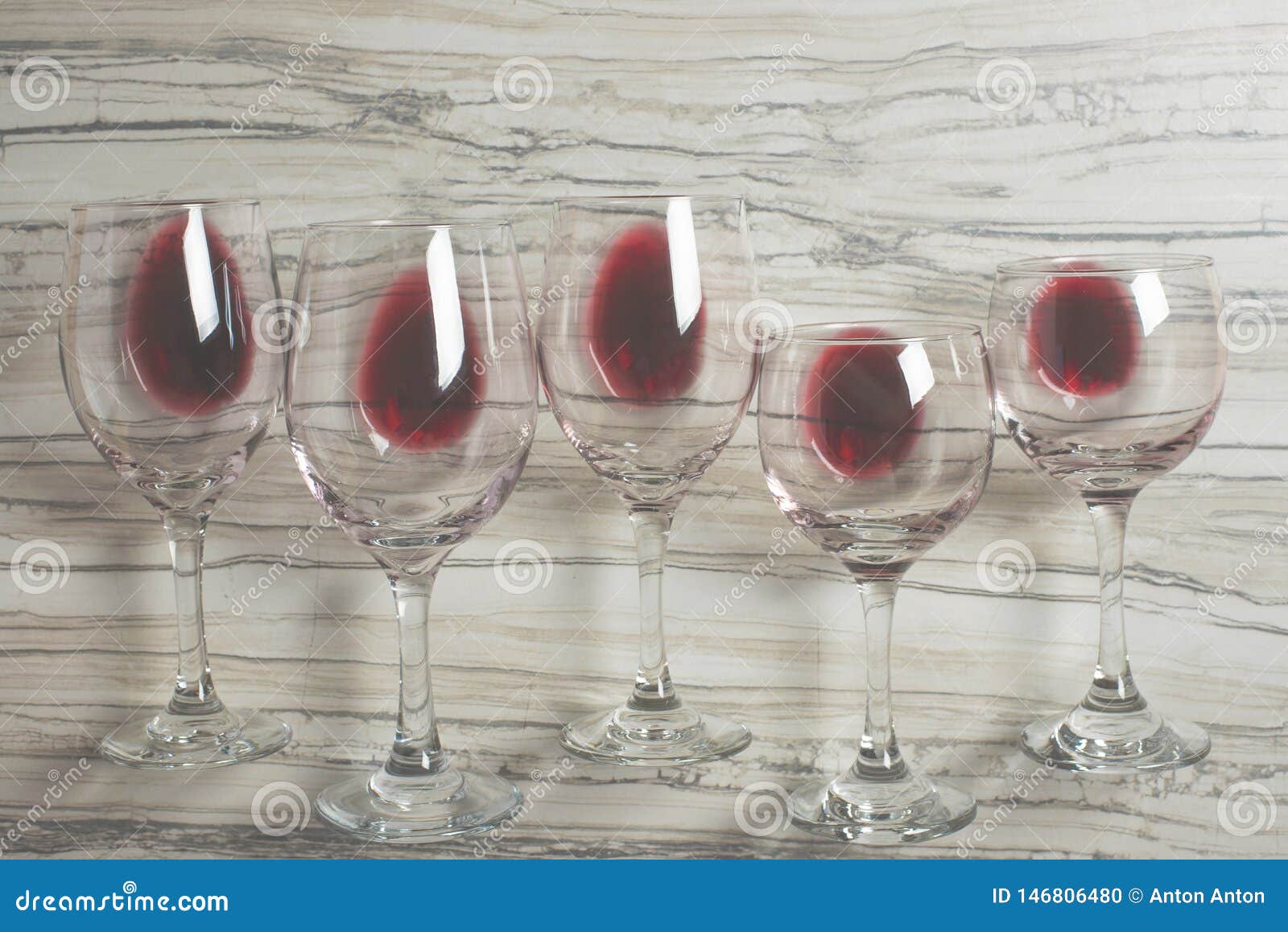 flat lay background with glasses with red wine on betton background, concept of winegrowing, winery, winery, wine bar, party