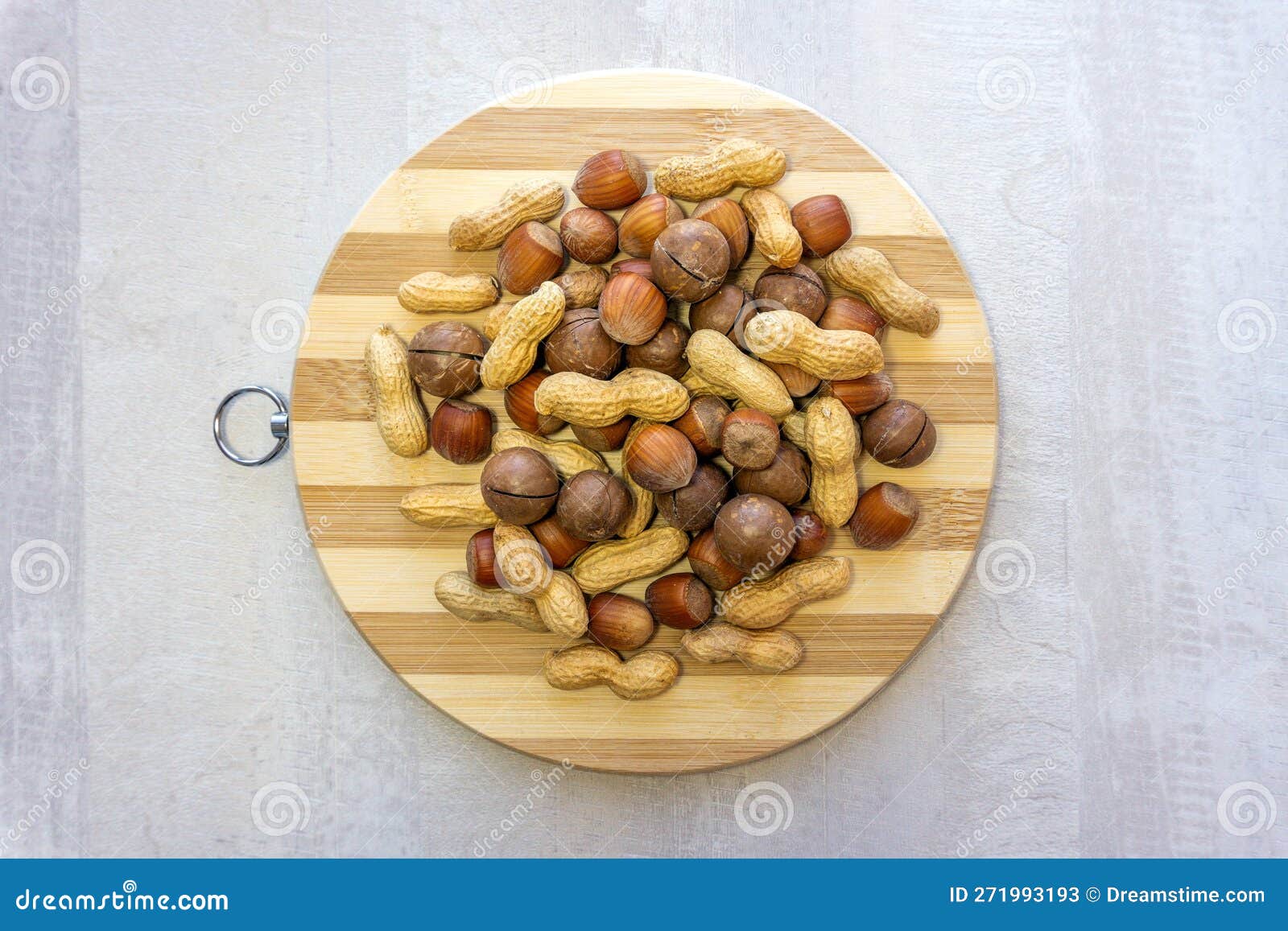 Flat Lay, Closeup of Assorted Nuts Hazelnuts, Peanuts, Brazil Nuts (macadamia) on a Round