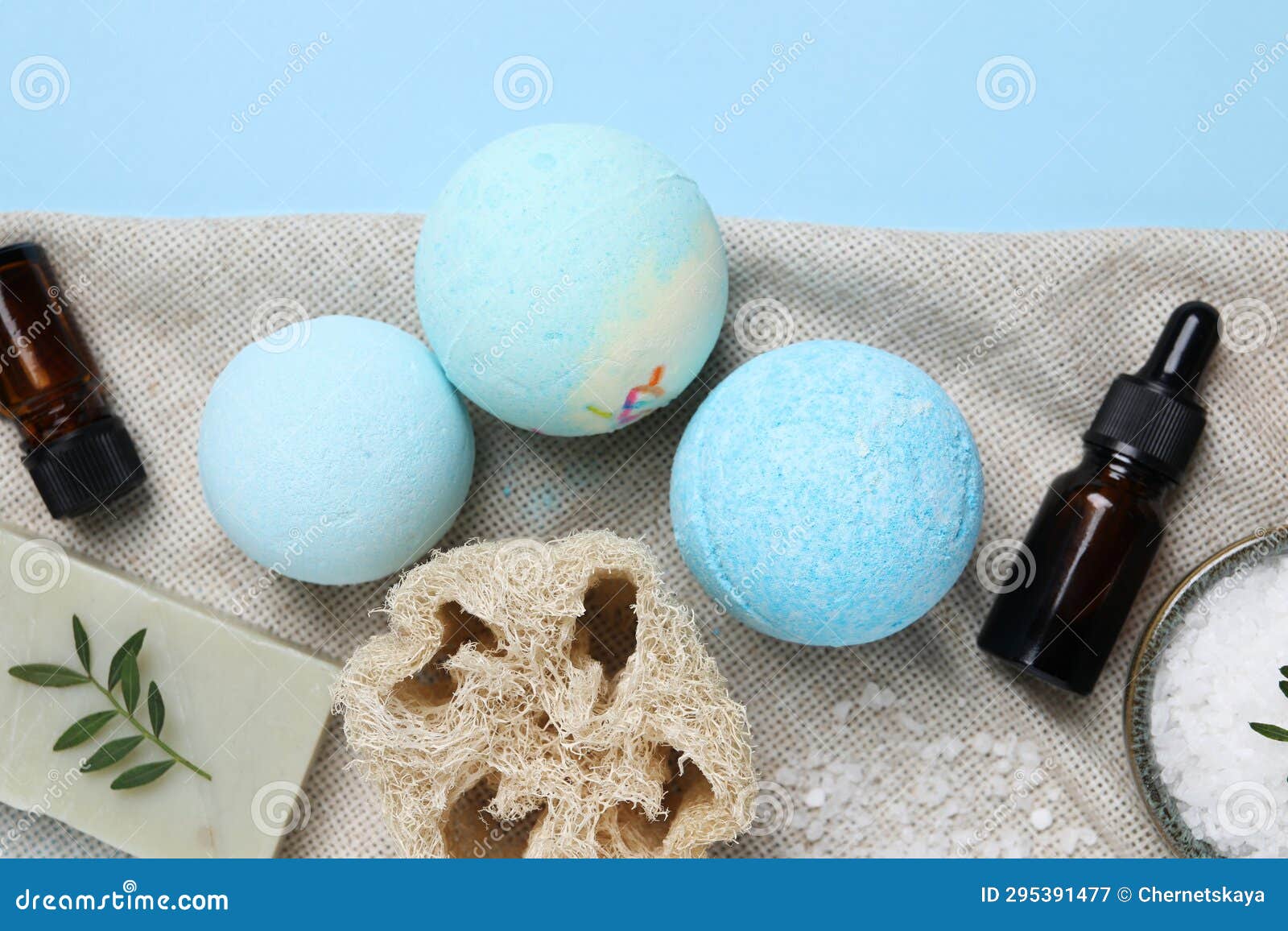 Flat Lay Composition with Bath Bombs on Light Blue Background Stock