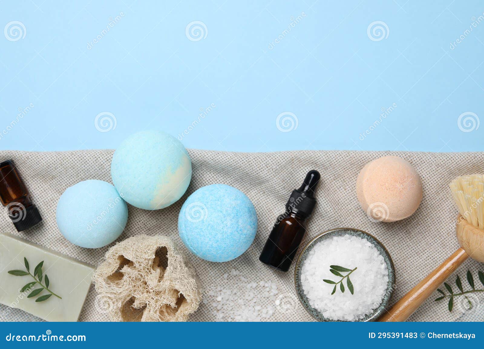 Flat Lay Composition with Bath Bombs on Light Blue Background. Space