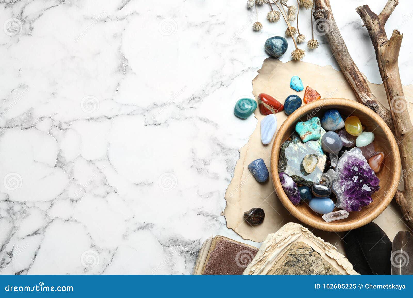 flat lay composition with different gemstones on marble background. space for text