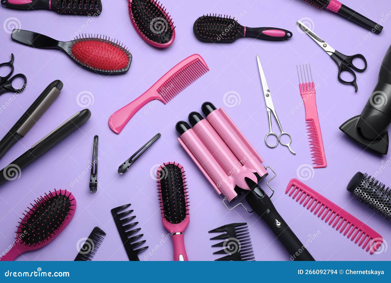 Flat Lay Composition of Different Professional Hairdresser Tools on Lilac Background Stock Photo