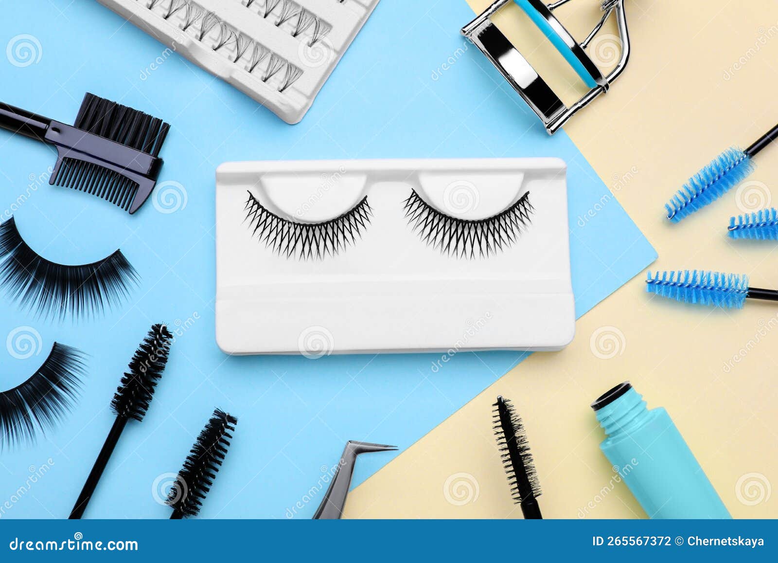 Flat Lay Composition with Fake Eyelashes, Brushes and Tools on Color