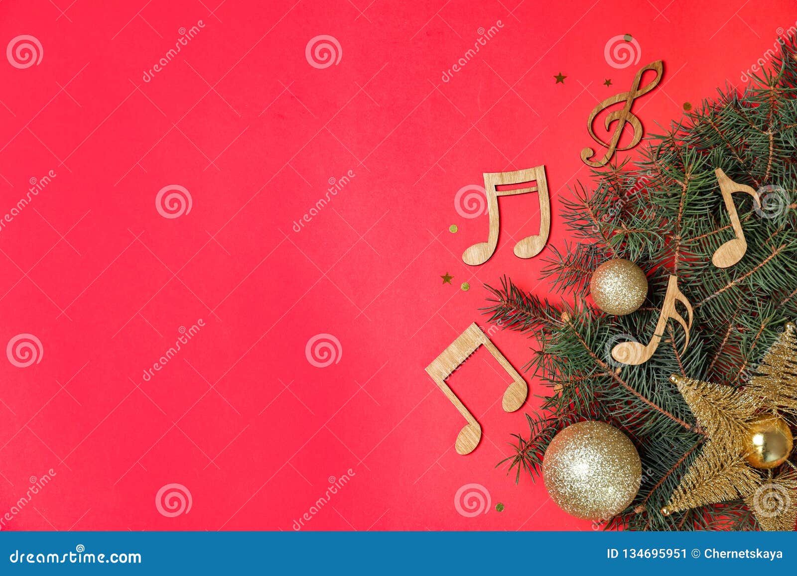 flat lay composition with fir tree, christmas decor and wooden music notes on color background.