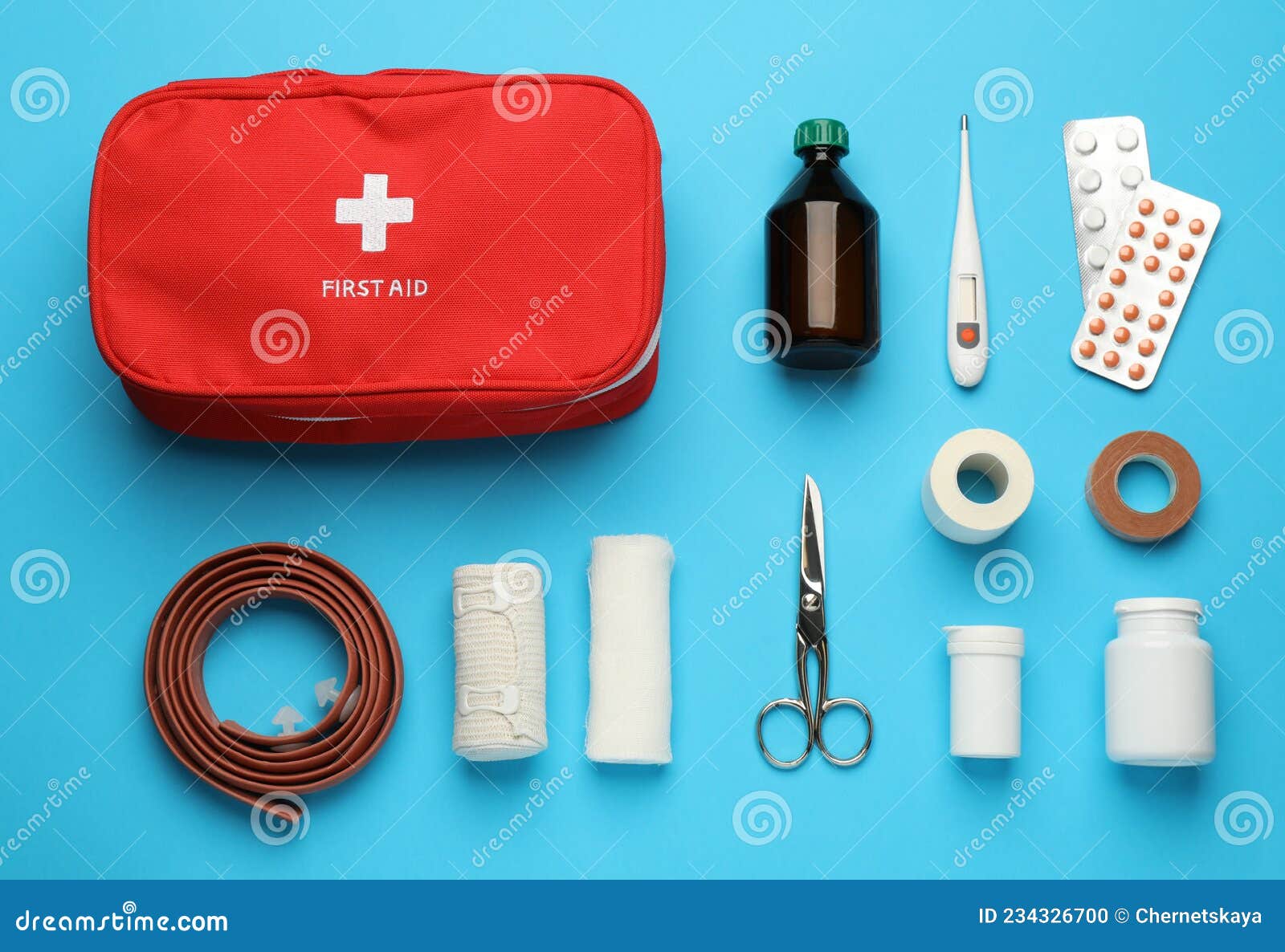 Flat Lay Composition with First Aid Kit on Light Blue Background Stock