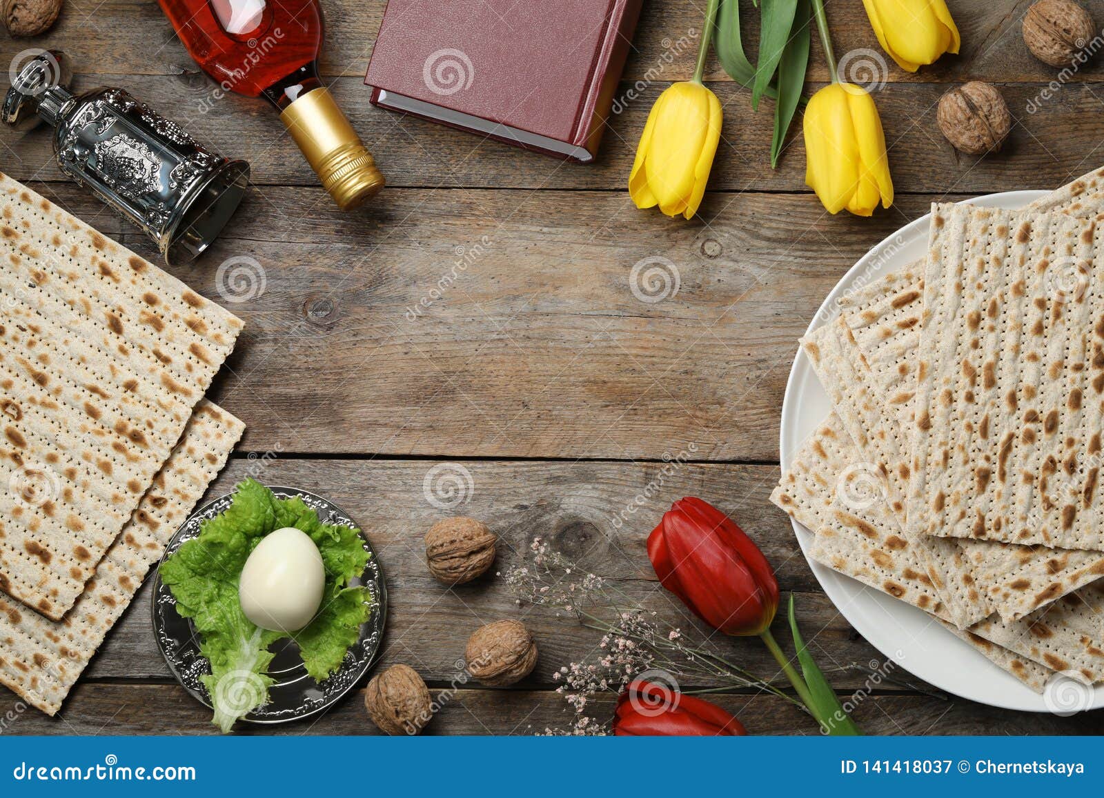 Flat Lay Composition with Symbolic Passover Pesach Items on Wooden